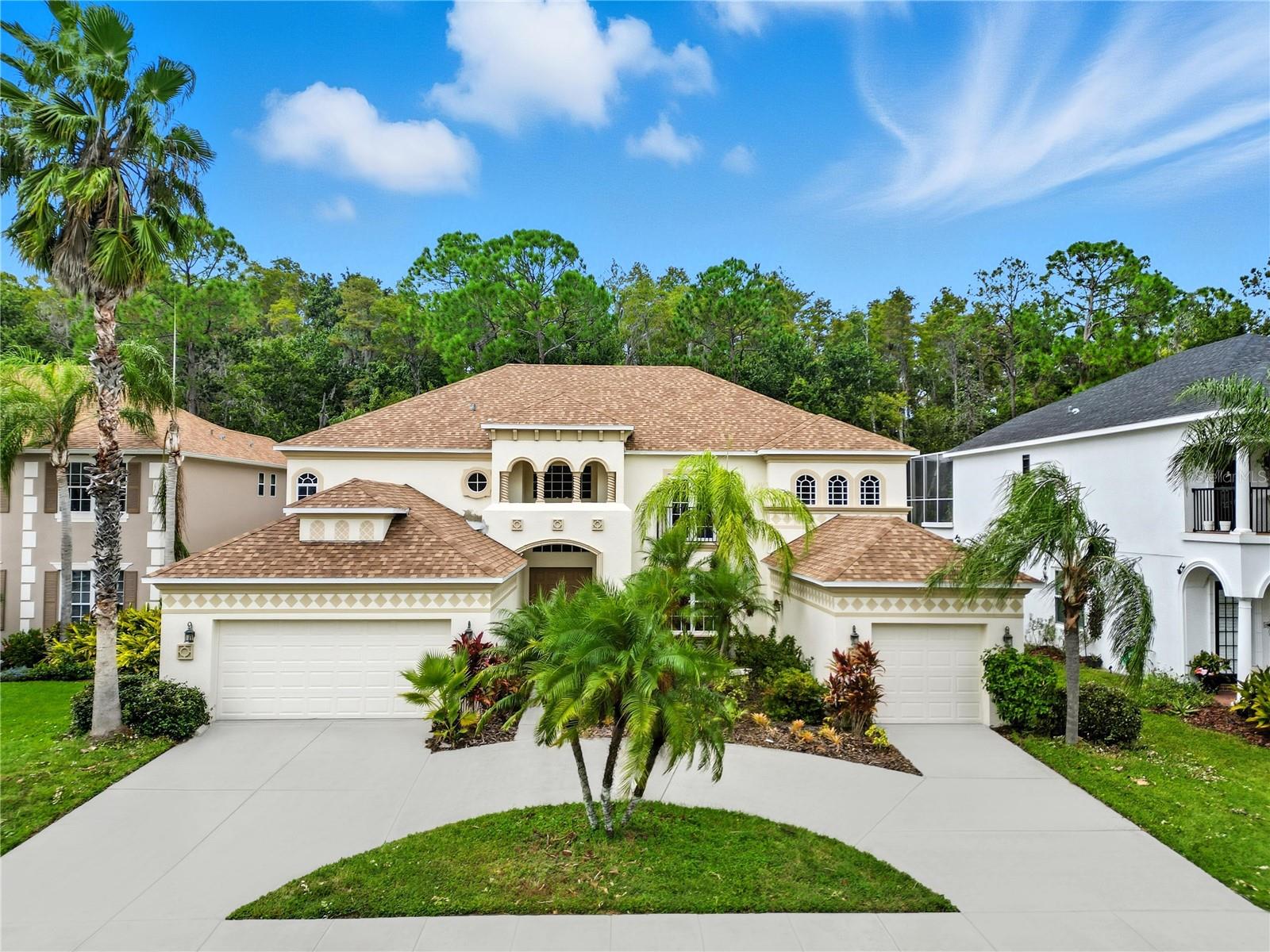Presenting Magnificent Estate, an extraordinary Mediterranean-inspired masterpiece nestled within the prestigious Seven Oaks community. This stunning residence harmonizes timeless elegance with modern refinement, offering an unparalleled living experience. From the moment you arrive, the circular driveway and stately garages make a striking first impression, setting the stage for what lies beyond. Step through the grand entrance and be welcomed by an interior that radiates sophistication and comfort. The formal living room provides the perfect ambiance for elegant gatherings or quiet afternoon tea, while the adjacent formal dining room offers an exquisite setting for memorable dinners. The gourmet kitchen is a culinary showpiece, featuring expansive granite countertops, premium cabinetry, and generous space ideal for both intimate meals and grand entertaining. Flowing effortlessly from the kitchen, the spacious family room invites relaxation with its warm atmosphere and seamless connection to the outdoors. The primary suite is a sanctuary of luxury, showcasing a beautifully remodeled spa-inspired bathroom and an expansive walk-in closet. Down the hall, a stylish guest bathroom and large bedroom offer refined comfort and privacy. Ascend the graceful staircase to find four additional bedrooms—each boasting its own walk-in closet—along with two full baths and a versatile loft overlooking the grand living spaces below. Around the corner, an exceptional bonus room awaits—perfectly suited for a home theater, game room, or private retreat. Step outside to your private resort oasis where the shimmering pool and spa, surrounded by exquisite travertine tile, create a breathtaking backdrop for outdoor entertaining or tranquil relaxation. Every detail of this Estate Magnificent residence embodies luxury, comfort, and impeccable design—truly redefining the meaning of home.