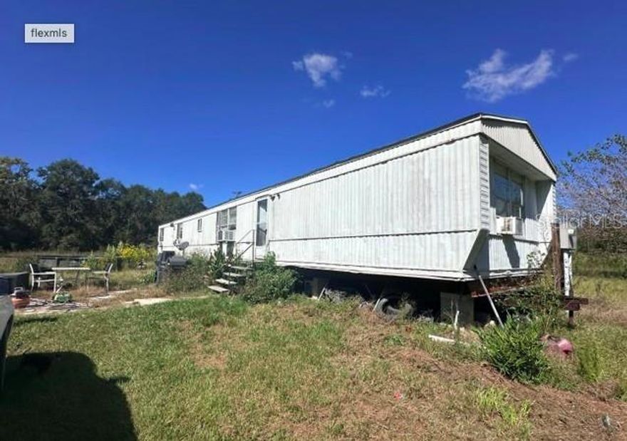 Your own private oasis set on 10 beautiful acres! Like living in serenity? This is the home for you - live in peace without the world on top of you. Mobile home is livable or use it while you build your dream home or replace it with another mobile home. The septic, well, and
electric are all there.