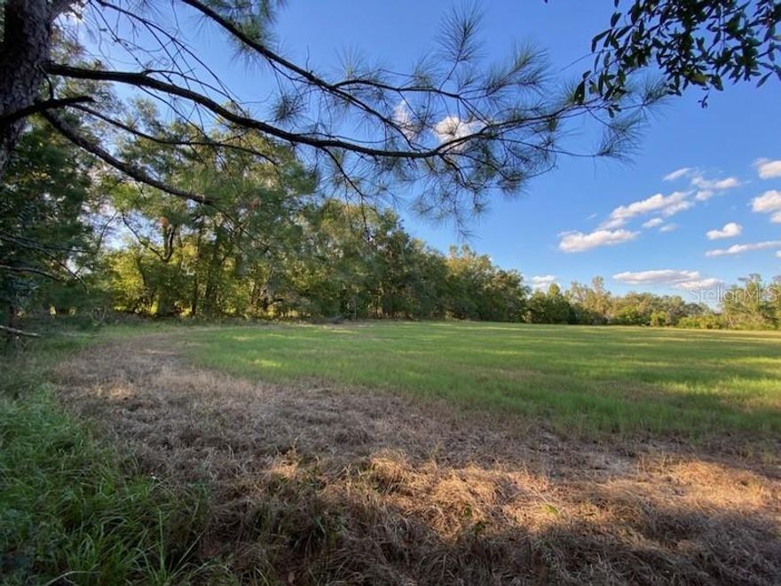 Country Living at its best! Discover the perfect property to bring your vision to life! This beautiful 5.2 acre parcel offers endless possibilities—build your dream home, start a small farm, or create a peaceful retreat. With open space, pasture, mature trees, and easy access to the interstate, this property provides the ideal blend of privacy and convenience. Imagine listening to the sounds of mother nature as you enjoy your morning coffee. Conveniently located close to recreation, small town charm, shopping, eateries, and much more. You won't want to miss out on this slice of heaven.