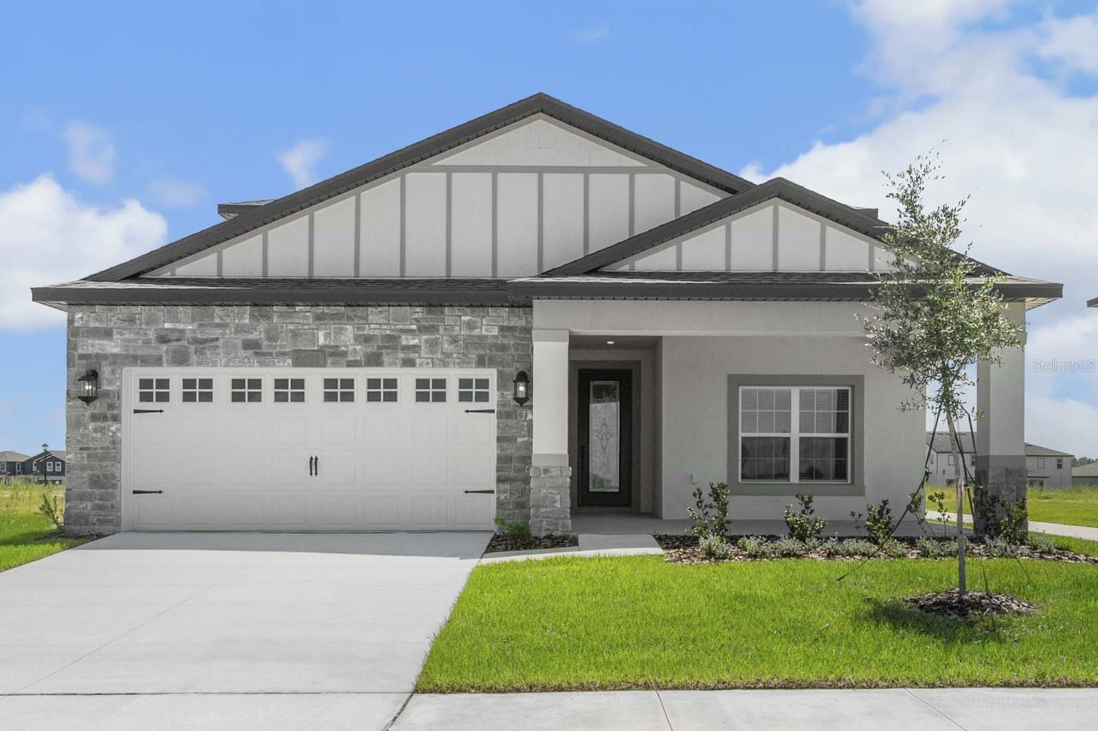 Introducing the Jasmine – A Spacious Two-Story Home in Gum Lake Preserve!
Welcome to the Jasmine floor plan, a stunning new 5-bedroom, 2.5-bathroom home in the vibrant Gum Lake Preserve community! Designed for comfort, versatility, and modern living, this two-story home offers abundant space and thoughtful features throughout.
Step through the grand covered front porch into a spacious foyer with a view of the staircase, setting the tone for the open and inviting layout that follows. At the front of the home, you’ll find a flexible den/library—perfect as a home office, reading nook, or second sitting room—finished with durable luxury vinyl flooring. Just past the foyer is the expansive open-concept living, dining, and kitchen area, ideal for both relaxing and entertaining.
The kitchen is a true centerpiece, boasting quartz countertops, stainless steel Whirlpool appliances (including a side-by-side refrigerator), white shaker-style cabinets, matte black hardware, a subway tile backsplash, and a breakfast bar perfect for casual dining. A large walk-in pantry provides excellent storage. Nearby, you’ll find a convenient laundry room and a half bathroom, all located on the first floor for maximum ease.
The private first-floor master suite offers a peaceful retreat with luxury vinyl flooring, space for a king-sized bed and seating area, a massive walk-in closet, and an en-suite bath complete with dual sinks. Upstairs, four additional bedrooms—all with plush carpeted flooring and ample closet space—surround a spacious game room perfect for play, movie nights, or a teen hangout. The second full bathroom also includes dual sinks for added convenience.
The home is packed with energy-efficient features, including double-pane insulated low-E windows, a programmable thermostat, and blinds installed on every window for privacy and light control. A covered back patio offers the perfect space for outdoor relaxation, while the giant front porch welcomes guests with charm and style.
Gum Lake Preserve is a scenic lakeside community offering a laid-back, nature-focused lifestyle. Enjoy peaceful walking trails, family picnics near the ponds, afternoons at the playground, and water adventures on Gum Lake, with access via the community boat ramp and a planned fishing dock. Located just minutes from I-4, the community provides an easy commute to both Tampa and Orlando, combining natural beauty with everyday convenience.
Don’t miss your chance to own the Jasmine—spacious, stylish, and ready for your family in one of Central Florida’s most exciting lakefront communities! Schedule your private tour today!