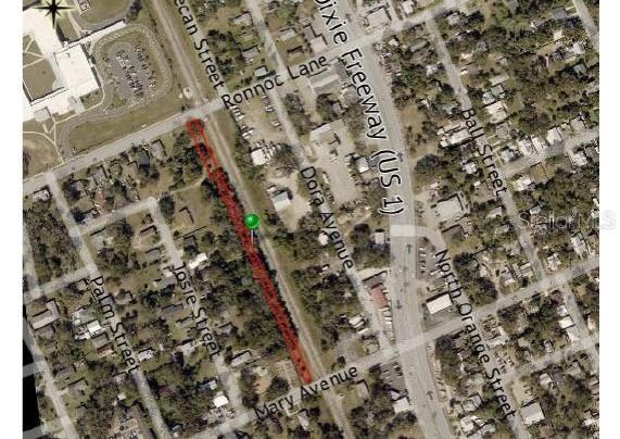 Long, narrow parcel of land located just west of the railroad tracks. Ideal for medium/low density residential development. Single family or manufactured modular.