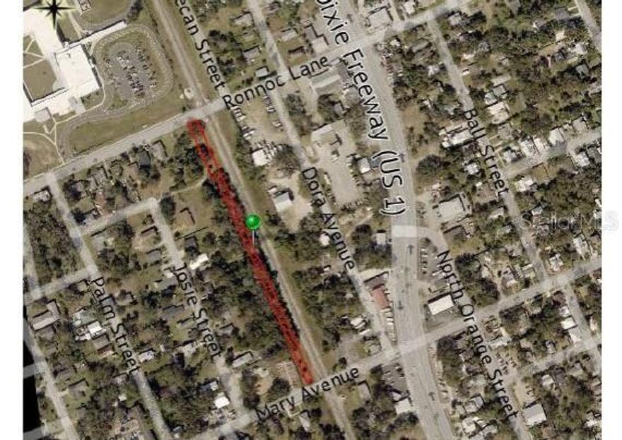 Long, narrow parcel of land located just west of the railroad tracks.  Ideal for medium/low density residential development.  Single family or manufactured modular.