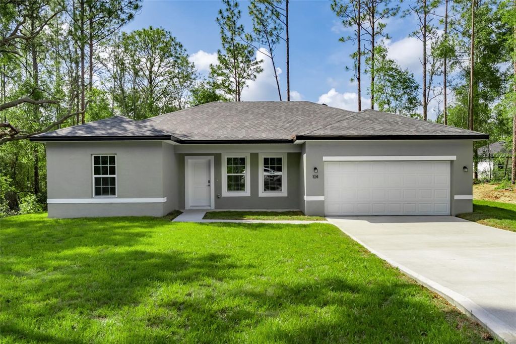 Photo of 104 W Gondolier Place, Citrus Springs, FL 34434 (MLS # O6316705)