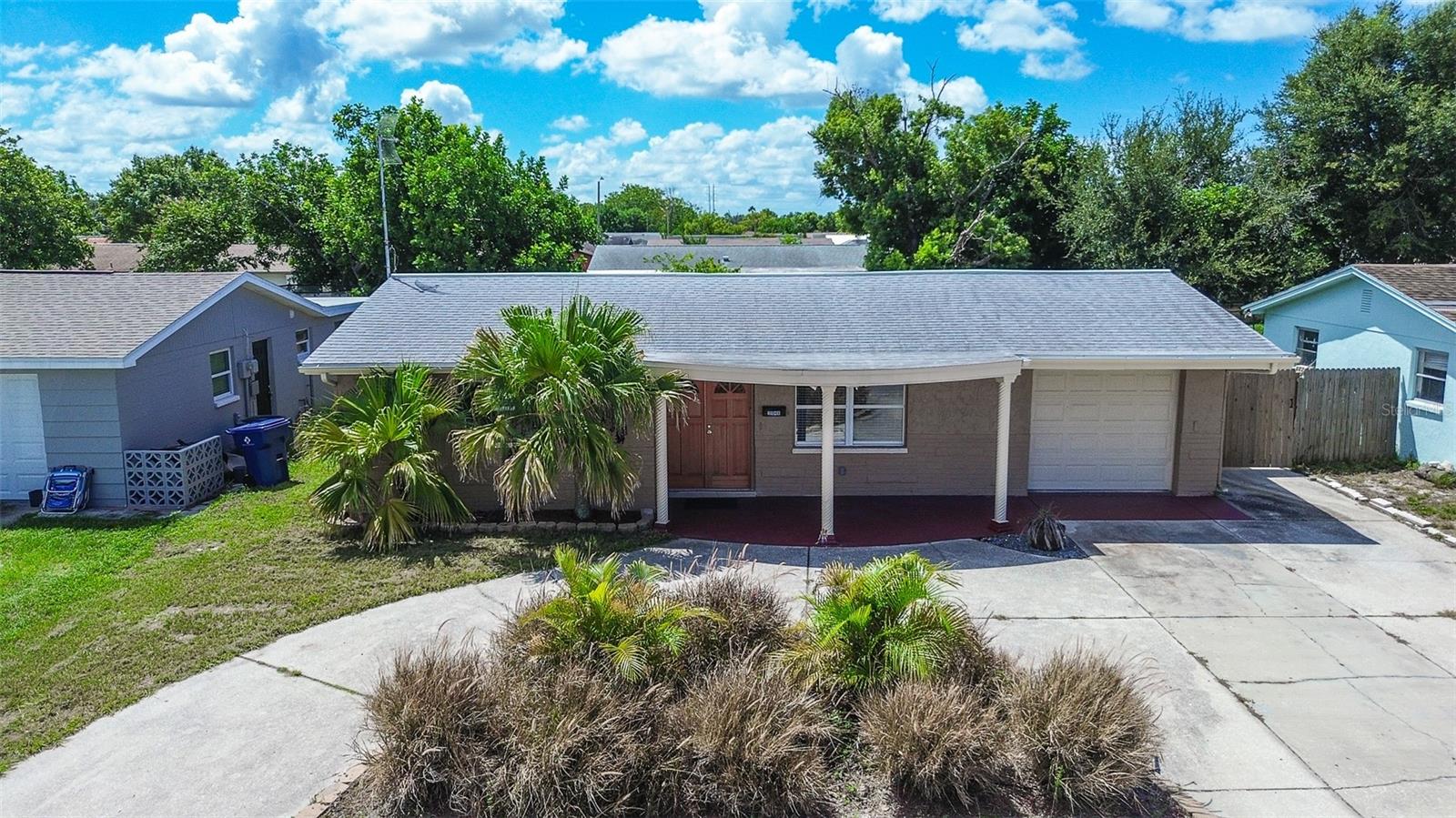 NO FLOOD ZONE. Lots of Updates. NEW LVP FLOORING throughout 2024. Remodeled Kitchen with New Shaker Cabinets & New Stainless Steel Appliances. Remodeled Bathrooms. NEW AC 2022. NEW ROOF 2020. New Paint in & out. New interior doors, new high baseboards. New double front door 2024. New fence 2024. 3 BEDROOMS Plus Bonus/Flex space for comfortable family living (could be HOME OFFICE, game room, kid’s playroom). 2 Full Bathrooms, one with dual sinks. Plenty of parking for all your vehicles, circle driveway, additional parking pad. Wide gate for parking jet ski and trailer in side yard behind fence. Open patio in back for grilling and chilling. Privacy fenced backyard for the kids to play and pets to roam. Conveniently located near schools, hospitals, shopping, parks, beaches, the Coastal Anclote Trail and Anclote Park, and the beloved Tarpon Springs Sponge Docks with waterside dining & entertainment. Part of garage was converted to 2 Bathroom, there is still 200sqft garage 16ft deep. Not full 1 car but can hold a compact size to a small car.