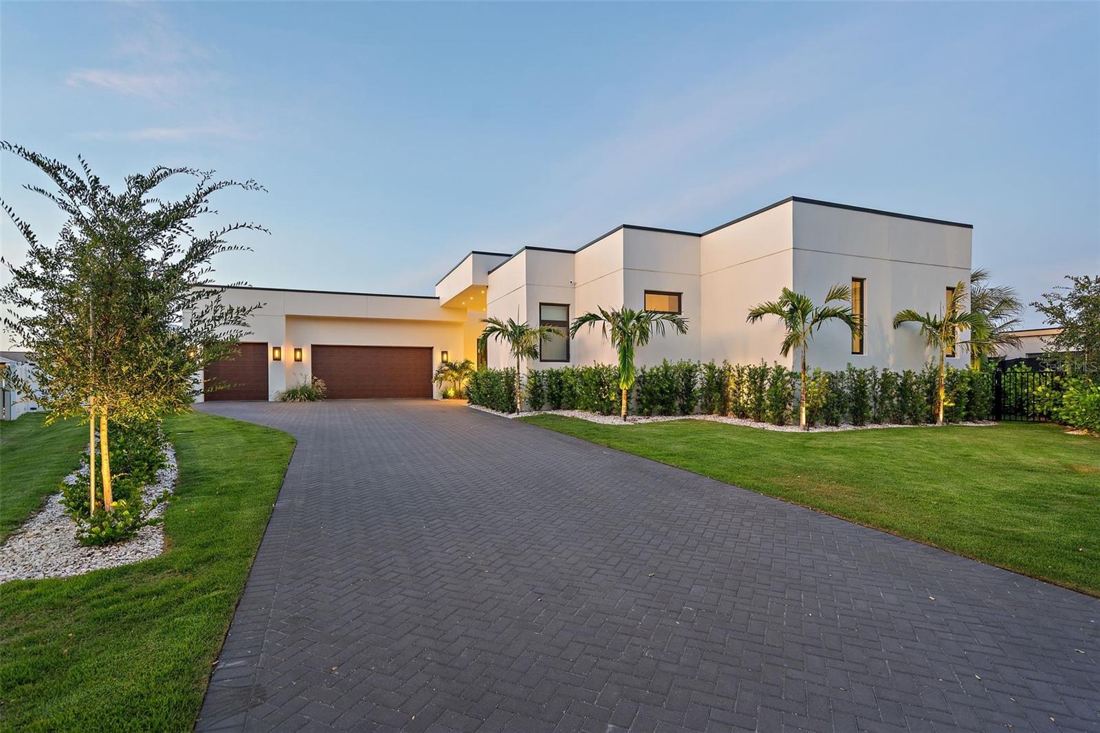 If you’re truly ready for the very best, this is your next destination.
Commanding a premier position on Tierra Verde’s Grand Canal, 501 Barcelona Drive is a trophy residence for those who demand architectural excellence, privacy, and an exceptional waterfront lifestyle. Behind its clean modern lines lies a home designed for how you truly want to live—with world-class entertaining and elevated day-to-day living unfolding seamlessly across one impeccably built level. From the disappearing-edge pool to the curated finishes, every detail is conceived to inspire and impress.
This nearly new custom build, completed in 2024 by its current owners, was designed with a visionary use of form and texture by Mandy Vallowe; simply to be in it evokes a rare fusion of sophistication and serenity. Indoor spaces flow into luxurious outdoor living, complete with a deluxe outdoor kitchen and a disappearing-edge waterfall framed by a true boater’s paradise.
The kitchen is a showcase of refined performance and elegance, centered around a dramatic island wrapped in honed Calacatta Borghini marble. It features a gas cooktop, convection oven, and microwave—all by Gaggenau—alongside a built-in Sub-Zero refrigerator and dual sets of Fisher & Paykel dish drawers. Finished with exceptional craftsmanship, the space is equally suited to daily living and luxury entertaining. Behind the kitchen, a spacious butler’s pantry offers added counter space, generous storage, and a secondary refrigerator/freezer.
The construction is nothing short of extraordinary. Built by Crescent Homes—an award-winning firm with over 5,000 residences completed—the home was engineered with a commercial mindset rarely applied to residential builds. All-block construction, cast-in-place concrete beams (many with #8 rebar), commercial ES-rated windows, and 159 deep pilings beneath the home and pool form a structural core more akin to a boutique hotel than a residence. Level 5 smooth-finished walls offer gallery-quality surfaces ideal for art.
The home, patio, and elevated infinity-edge pool all reside on the same plane—enhancing resilience, ensuring privacy from passing boats, and allowing interior and exterior spaces to function as one. Over half a million dollars was invested in structural elements that remain unseen yet deeply felt, contributing to the home’s exceptional quiet, strength, and peace of mind. A built-in bar anchors the living space, offering a sophisticated setting for entertaining with ease.
A fully automated Control4 system manages lighting, shades, audio, climate, security, and accent lighting—easily operated via custom remote or app.
A 36kW solar energy system offsets nearly all power bills and feeds power back to the grid.
Located on Tierra Verde’s Grand Canal—some of the most coveted boating water on the Gulf Coast—the property’s dockage, with slip and lift, offers near-instant access to the open Gulf and Intracoastal at one end and Port32 marina at the other.
Tierra Verde is a private island community perfectly positioned between the Gulf’s award-winning beaches and the vibrancy of downtown St. Petersburg—with fine dining, acclaimed museums, waterfront parks, and international airports all nearby.