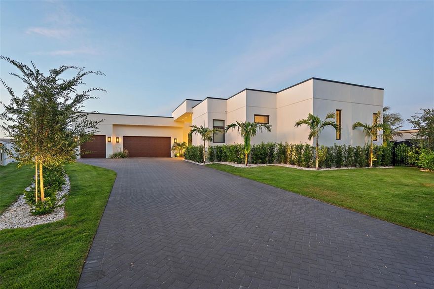If you’re truly ready for the very best, this is your next destination.

Commanding a premier position on Tierra Verde’s Grand Canal, 501 Barcelona Drive is a trophy residence for those who demand architectural excellence, privacy, and an exceptional waterfront lifestyle. Behind its clean modern lines lies a home designed for how you truly want to live—with world-class entertaining and elevated day-to-day living unfolding seamlessly across one impeccably built level. From the disappearing-edge pool to the curated finishes, every detail is conceived to inspire and impress.

This nearly new custom build, completed in 2024 by its current owners, was designed with a visionary use of form and texture by Mandy Vallowe; simply to be in it evokes a rare fusion of sophistication and serenity. Indoor spaces flow into luxurious outdoor living, complete with a deluxe outdoor kitchen and a disappearing-edge waterfall framed by a true boater’s paradise.

The kitchen is a showcase of refined performance and elegance, centered around a dramatic island wrapped in honed Calacatta Borghini marble. It features a gas cooktop, convection oven, and microwave—all by Gaggenau—alongside a built-in Sub-Zero refrigerator and dual sets of Fisher & Paykel dish drawers. Finished with exceptional craftsmanship, the space is equally suited to daily living and luxury entertaining. Behind the kitchen, a spacious butler’s pantry offers added counter space, generous storage, and a secondary refrigerator/freezer.

The construction is nothing short of extraordinary. Built by Crescent Homes—an award-winning firm with over 5,000 residences completed—the home was engineered with a commercial mindset rarely applied to residential builds. All-block construction, cast-in-place concrete beams (many with #8 rebar), commercial ES-rated windows, and 159 deep pilings beneath the home and 30 more beneath the pool deck form a structural core more akin to a boutique hotel than a residence. Level 5 smooth-finished walls offer gallery-quality surfaces ideal for art.

The home, patio, and elevated infinity-edge pool all reside on the same plane—enhancing resilience, ensuring privacy from passing boats, and allowing interior and exterior spaces to function as one. Over half a million dollars was invested in structural elements that remain unseen yet deeply felt, contributing to the home’s exceptional quiet, strength, and peace of mind. A built-in bar anchors the living space, offering a sophisticated setting for entertaining with ease.

A fully automated Control4 system manages lighting, shades, audio, climate, security, and accent lighting—easily operated via custom remote or app.

A 36kW solar energy system offsets nearly all power bills and feeds power back to the grid.

Located on Tierra Verde’s Grand Canal—some of the most coveted boating water on the Gulf Coast—the property’s dockage, with slip and lift, offers near-instant access to the open Gulf and Intracoastal at one end and Port32 marina at the other.

Tierra Verde is a private island community perfectly positioned between the Gulf’s award-winning beaches and the vibrancy of downtown St. Petersburg—with fine dining, acclaimed museums, waterfront parks, and international airports all nearby.