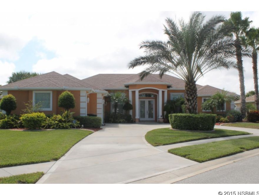 Beautifully landscaped, gorgeous custom built executive home in a unique gated community. This home offers three bedrooms and three full baths , an added bonus with a den off the family room.   Relax by the large private/screened salt pool, with 40 x 10 screened lanai beautifully tiled and spacious, lots of room for the toys and entertaining.  Enter through the French doors to a light and bright kitchen with stainless steel appliances, abundant cabinet space along with room for your kitchen set.  A center island allows for extra work area and storage.  The light and colorful separate dining room is great for family gatherings.  The family room has a gas fireplace and large area for the TV.  White Plantation shutters show well throughout the home.  French doors also in master bedroom leading to the lanai,  his and hers closets, and a beautifully tiled bath.  The vaulted, tray ceilings give all the rooms an open spacious feeling.  The home has storm shutters,, an added plus for insurance.  Come use your kayak from the community launch area, stroll over the bridge on the nature trail  that leads to the intra coastal waterway. There is plenty of space for your vehicles in the 3 car garage. Home also has a generator.  You are not only buying a home, but a relaxing, charming lifestyle in a upscale community while having  comfort and  privacy. ;Water: City