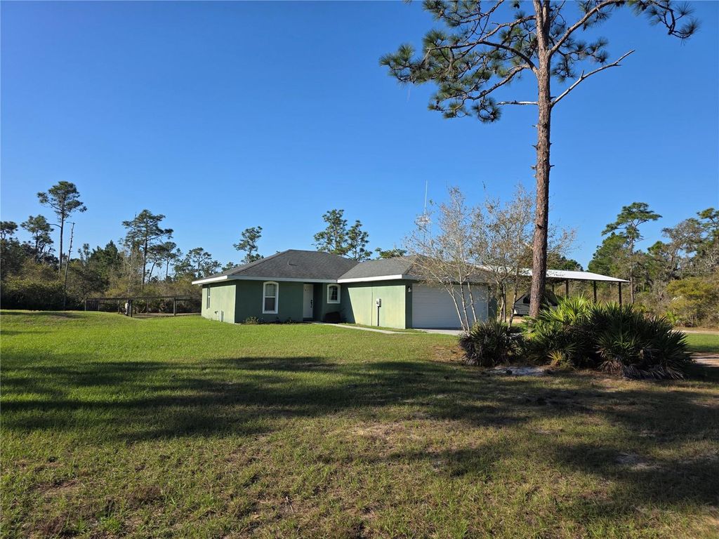 Photo of 1991 Rosalie Lake Road, Lake Wales, FL 33898 (MLS # K4903377)