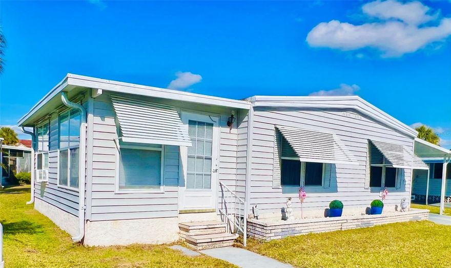New Price! Welcome to this exquisite double-wide manufactured home nestled in the desirable Venetian Park Estates. This beautifully appointed 2-bedroom, 2-bathroom residence boasts a classy coastal ambiance, complete with tasteful furnishings. The home features a newly installed kitchen with updated cabinets, refrigerator-freezer, and dishwasher, complemented by an inviting island dining area. The master suite includes a new king-sized bed, while the guest bedroom offers ample space. Two beautifully renovated bathrooms and a delightful, air-conditioned finished lanai enhance the comfort. Additional highlights include a spacious workshop and a separate laundry room. Venetian Park Estates offers residents a community heated pool, hot tub, shuffleboard court, and an active clubhouse. Engage in community events such as Bingo, Trivia, Poker, and Card games, as well as seasonal festivities, all enhanced with food and live entertainment. Conveniently located, shopping centers are just blocks away, and the world-renowned Siesta Beach is only a short 5-mile drive.