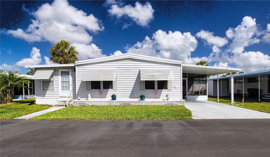New Price! Welcome to this exquisite double-wide manufactured home nestled in the desirable Venetian Park Estates. This beautifully appointed 2-bedroom, 2-bathroom residence boasts a classy coastal ambiance, complete with tasteful furnishings. The home features a newly installed kitchen with updated cabinets, all new appliances, and dishwasher, complemented by an inviting island dining area. The master suite includes a new king-sized bed, while the guest bedroom offers ample space. Two beautifully renovated bathrooms and a delightful, air-conditioned finished lanai enhances the comfort. Additional highlights include a spacious workshop and a separate laundry room. Venetian Park Estates offers residents a community heated pool, hot tub, shuffleboard court, and an active clubhouse. Engage in community events such as Bingo, Trivia, Poker, and Card games, as well as seasonal festivities, all enhanced with food and live entertainment. Conveniently located, shopping centers are just blocks away, and the world-renowned Siesta Beach is only a short 5-mile drive.