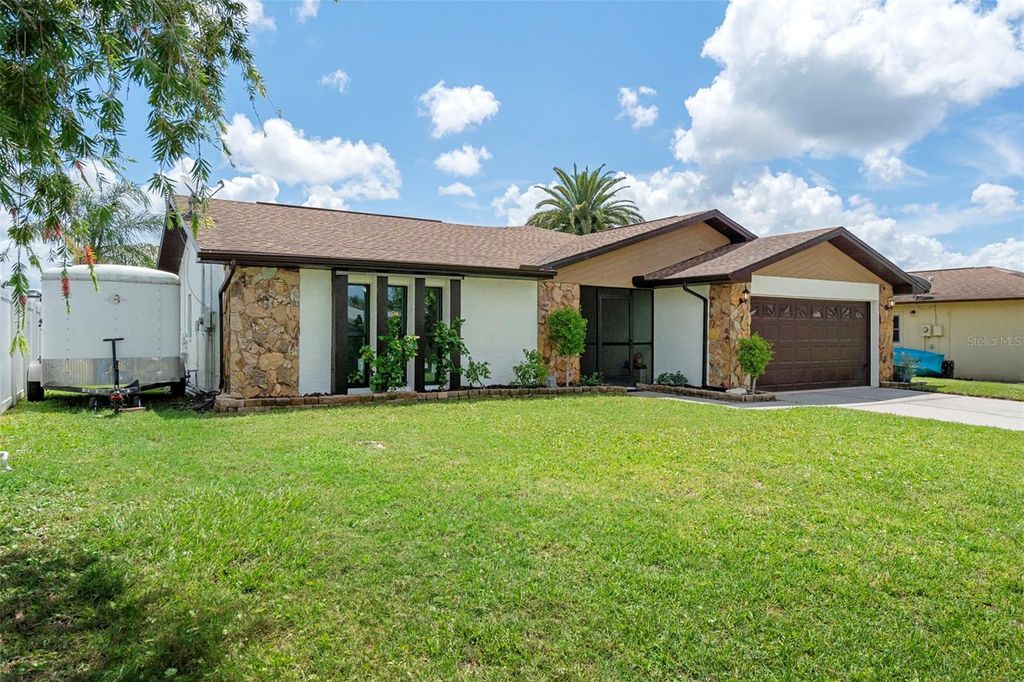 Photo of 9910 Island Harbor Drive, Port Richey, FL 34668 (MLS # TB8416352)