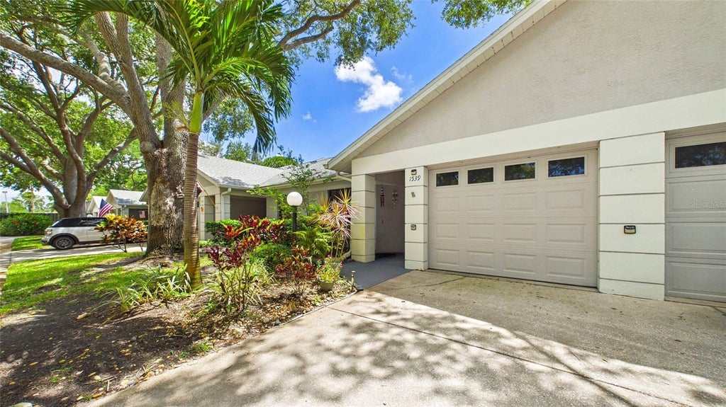 Photo of 1539 Rebecca Lane, Dunedin, FL 34698 (MLS # TB8556656)