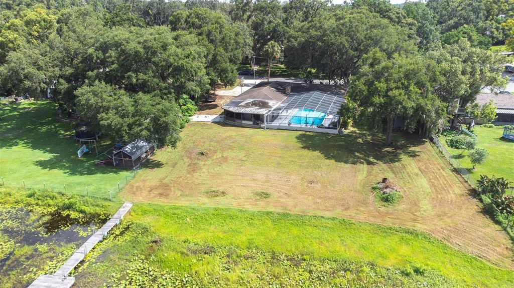 Photo of 35836 Lakeshore Drive, Dade City, FL 33525 (MLS # TB8398038)