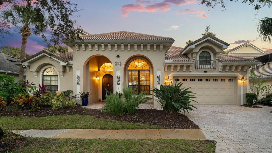 Intracoastal Luxury Redefined in Grand Haven! Set within the exclusive Front Street enclave of Grand Haven, this two-story, 5 bedroom masterpiece captures the essence of waterfront elegance. Perfectly positioned along the Intracoastal Waterway, this home offers a blend of architectural sophistication, serene privacy and resort-style living—a true sanctuary for those who expect nothing less than extraordinary. Beyond its timeless curb appeal lies a residence designed with sleek marble flooring through almost the entire home, anchored by an electric fireplace framed in matching stone—a subtle statement of modern refinement. A formal dining room sets the stage for elevated entertaining, while crown molding, high-end fixtures and thoughtful built-in detailing reflect the home’s craftsmanship throughout. The kitchen is a culinary showcase, featuring exotic granite countertops, shaker-style cabinetry, stainless steel appliances and a double-door refrigerator—a space as functional as it is stunning. Step outside and the backyard becomes the centerpiece of this exceptional property. With beautiful travertine flooring, an endless pool that allows you to swim against the current and a fully equipped outdoor kitchen with built-in appliances and granite surfaces - every element was designed for effortless hosting and relaxation. The pool-access bathroom offers dual vanities and a glass-enclosed shower, making it perfect for guests. The primary suite is a statement of refined comfort, complete with private access to the pool area, a custom walk-in closet and a luxurious ensuite boasting dual vanities, granite surfaces, a stand-alone soaking tub, glass shower and private water closet. Upstairs, an expansive bonus room with a fully appointed kitchenette provides endless flexibility—ideal for guests, extended family, or a private retreat. Sliding glass doors open to a spacious balcony overlooking the lushly landscaped backyard and the scenic Intracoastal beyond—a truly breathtaking view! And just steps from your back door, a private, covered dock awaits—ready to house your boat and provide a front-row seat to Palm Coast’s most picturesque sunsets. Surrounded by mature tree canopies, stone walkways and manicured grounds, this home delivers an unmatched sense of serenity while being moments from the best of coastal living. Residents of Grand Haven can enjoy access to an impressive array of community amenities, including a private Jack Nicklaus golf courses, a state-of-the-art fitness center, multiple swimming pools, tennis and pickleball courts, walking and biking trails and a full social calendar of community events. Every detail—from the neighborhood’s scenic beauty to its world-class amenities—embodies the effortless sophistication of the Grand Haven lifestyle. Elegant, timeless, and set in one of Palm Coast’s most coveted waterfront communities, this home is more than a residence—it’s a masterpiece of location and lifestyle. Enjoy a 2 mile esplanade to walk and ride bikes along the Intracoastal Waterway...Beautiful in the Evenings!!