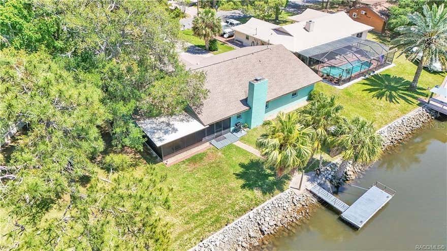 Updated waterfront home with Gulf access in Crystal River, Florida—designed for elevated coastal living. This beautifully maintained 3-bedroom, 2-bath residence offers 2,006 square feet of open-concept living, thoughtfully updated to blend comfort, style, and functionality. The home features granite countertops, stainless steel appliances with a range hood, and a warm wood-burning fireplace that anchors the main living space. The oversized primary suite provides a personal retreat, complemented by an indoor laundry room for added convenience. Step into the screened-in porch and unwind in the hot tub/spa, creating a perfect indoor-outdoor space to relax after a day on the water. There is also a shallow well (no pump) that can be used for irrigation. Designed for true waterfront enjoyment, the property includes a floating dock, fish-cleaning station, riprap seawall, and direct Gulf access, making boating, fishing, and kayaking effortless. Located within Citrus County limits, this home offers NO HOA and no rental restrictions, providing excellent rental income potential and unmatched flexibility—live here full-time, rent it out, or hold it as a long-term investment. The property offers a proven 10-year history of successful rentals, including a 5-star rating on VRBO. Conveniently located just approximately 11 minutes from downtown Crystal River, you’re near shopping, dining, and local favorites. The nearest public boat ramps are Fort Island Trail and Pete’s Pier, offering easy access to Kings Bay and the Gulf. Whether you’re searching for a luxury primary residence, coastal retreat, or waterfront investment, this property delivers the perfect combination of location, lifestyle, and opportunity.
