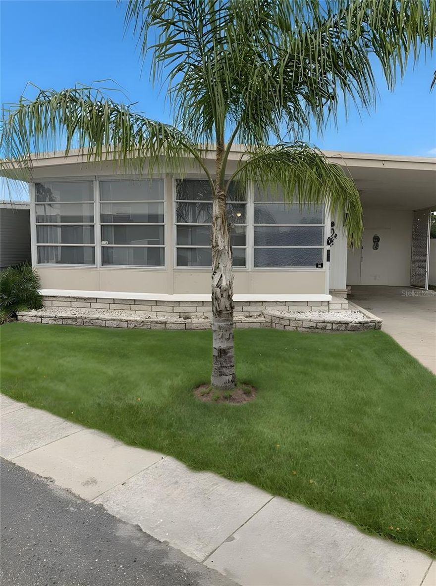 Looking for a move-in read home in a friendly 55+ community? This charming residence in *The Colony*, a resident-owned co-op, includes a $50,000 land share so there’s no lot rent.
Inside, the home features an open and bright floor plan with a spacious kitchen and an updated bathroom. The bright front Florida room, complete with a private entrance, offers flexible space for guests or extra living area. The covered carport provides parking and outdoor seating, and the storage closet is ideal for tools or beach gear. The Colony is peaceful and tucked away, yet close to everything. The community features wide streets, sidewalks, and well-kept homes. At the center is the clubhouse with a meeting hall, billiards, fitness room, library, and kitchen. Outside, enjoy the heated screened pool, shuffleboard courts, and additional on-site laundry.
You’re just minutes from shopping, gyms, and popular restaurants, plus some of Florida’s best beaches—St. Pete Beach, Treasure Island, Madeira Beach, and Clearwater Beach. The Pinellas Trail, only a few blocks away, offers 65 miles of scenic biking.
The low $275 monthly HOA includes Spectrum TV and internet, water, sewer, trash, mowing, pool access, and all amenities. A wonderful slice of Florida living—see it before it’s gone.