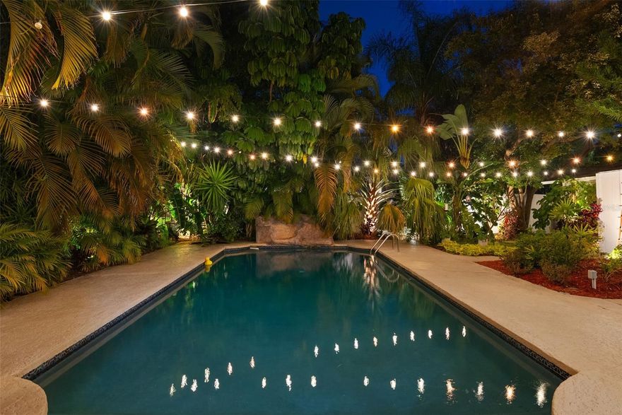 Live every day like you’re on vacation in your own fully updated tropical oasis—located in the highly sought-after Plant High School District, without the multi-million-dollar price tag. And for peace of mind: this home experienced no flooding or damage during recent hurricanes.

This rare, one-of-a-kind 3-bedroom, 3-bath pool home sits on an expansive 0.22-acre corner lot with two private driveways. Inside, you’ll find bright, open living spaces filled with natural light, an updated chef’s kitchen featuring a 6-burner gas range, large island, and abundant storage, along with fully remodeled bathrooms and updated flooring throughout.

The converted garage adds valuable bonus living space with an adjacent en-suite bath (not included in the square footage). Large French doors open directly to the lush backyard, creating a seamless indoor-outdoor flow.

Step outside and enjoy true resort-style living: a large heated pool with an 8-foot deep end, expansive deck, private outdoor shower under the stars, and a versatile detached efficiency pool house—ideal for a home office, guest suite or extra bedroom. The pool was upgraded with a new pump, filter, and heater in 2023. Large outdoor shed provides lots of extra storage space.

Additional major recent upgrades include a new roof (2020) with retrofit hurricane clips (2023), updated insulation and ductwork (2022), new irrigation and landscape lighting (2022), a new electrical panel (2024), and fresh interior paint. Smart-home upgrades include Lutron lighting, an Ecobee thermostat, and motorized curtains, all app-controlled. The primary bath features a heated, automatic bidet toilet. Sauna and furniture are negotiable.

Thoughtfully upgraded and move-in ready.