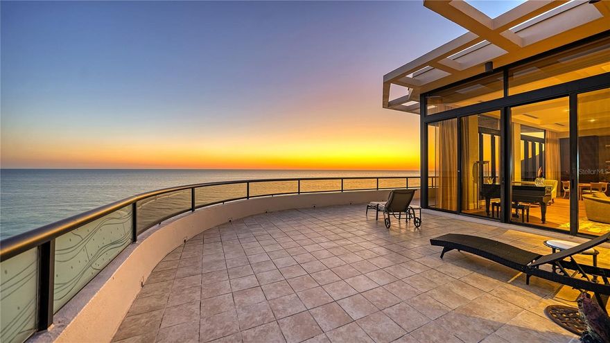 Welcome to the pinnacle of sophisticated coastal living at L’Ambiance, where every detail has been meticulously designed to offer the utmost in elegance and comfort. This remarkable penthouse, located just steps away from the renowned Longboat Key Club, is a breathtaking testament to architectural excellence and refined luxury. Stepping into this exquisite residence, you are immediately greeted by unparalleled views that span from the azure waters of the Gulf of Mexico to the captivating beauty of Sarasota Bay and the sparkling downtown skyline. The scenery is nothing short of awe-inspiring. As you enter through the private elevator lobby, the grandeur of this penthouse unfolds before you. Every inch of its expansive 5,000 SF interior has been meticulously designed and recently updated by the renowned Aldo Boldi Interior Design. The interior is bathed in natural light, courtesy of the voluminous 10.5’ ceilings and walls of floor-to-ceiling glass sliders crowned with transom windows. Recent enhancements include the installation of new hardwood flooring that adds warmth and sophistication throughout the living spaces. Custom coffered ceilings, modernized bathrooms, and LED lighting further enhance the sense of luxury. An open concept living and dining area seamlessly blend together, creating an inviting space perfect for hosting guests. It's a testament to thoughtful design where entertaining becomes effortless. The south-facing chef's kitchen is a marvel of culinary artistry. Bathed in natural light streaming through its glass walls, it boasts solid wood cabinetry, stainless steel appliances, including a 6-burner gas range and hood, a farmhouse sink, granite countertops, a stylish tile backsplash, wine cooler, and an island with a breakfast bar. The sleek waterfall-edge island is a focal point where culinary creations transform into art. Three bedroom suites, each a haven of tranquility, are strategically arranged in a split layout to ensure both residents and guests enjoy their own personal retreats. The master suite is a secluded getaway thoughtfully positioned to capture the best of the day's natural light. A private terrace beckons you to savor your morning coffee amidst breathtaking views. This retreat also features his/her walk-in closets, spacious enough to accommodate even the most extensive wardrobe collections, plus an en-suite bathroom that is a work of spa-inspired opulence, offering a sanctuary for relaxation. You’ll find modern fixtures, contemporary design elements, and luxurious finishes that elevate your daily routine to a pampering experience. One of the defining features of this penthouse is the effortless transition between indoor and outdoor living spaces. Step outside onto one of the multiple inviting verandas, and you'll instantly be captivated by the stunning Gulf-to-bay breezes. Each room is thoughtfully connected to the terraces, creating an expansive and serene setting for enjoying Sarasota's enchanting sunsets. It's the perfect backdrop for entertaining or simply unwinding. This pet-friendly community offers a host of fabulous amenities to ensure your every need is met. From 24-hour concierge service and security to a resort-style heated pool and spa, outdoor BBQ area, well-equipped fitness center, clubhouse, media room, library, high-speed internet, and an overflow suite available to residents on a first-come basis, every aspect of luxury living has been carefully considered.