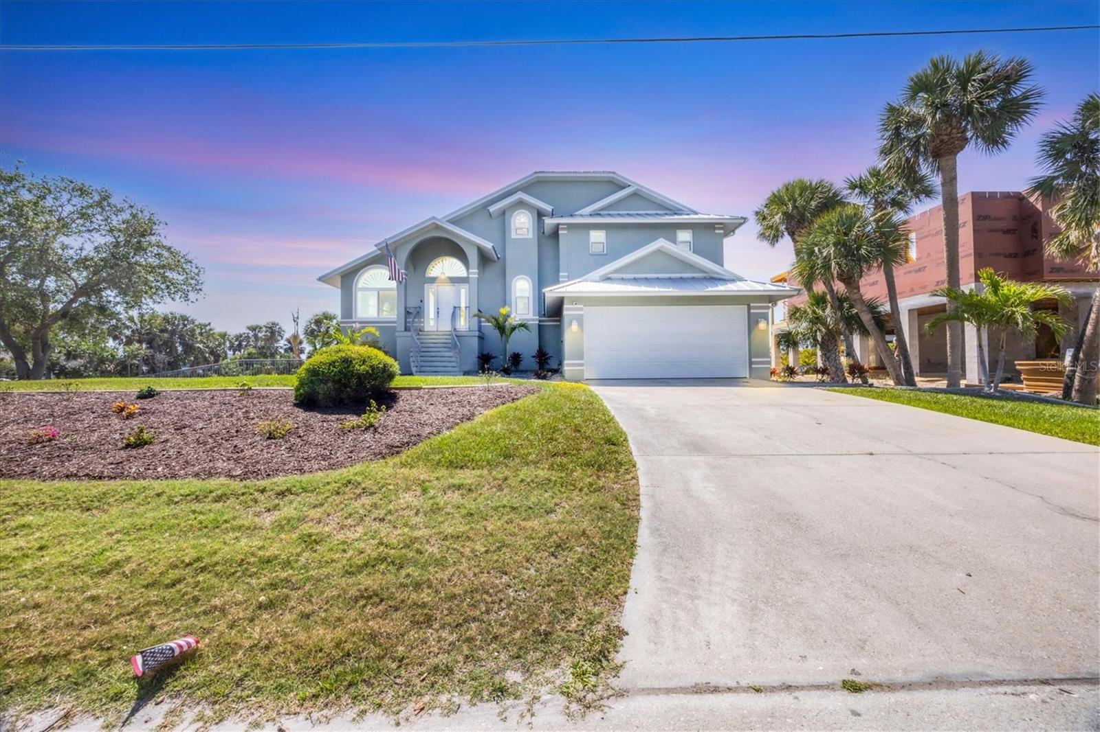 Absolutely Stunning Waterfront Retreat with Direct Access to the Intracoastal!
Look no further…You have found your FLORIDA DREAM HOME!!
This 3-bedroom + office, 2.5-bath, CANAL FRONT oasis with 2,306 sq ft of beautifully designed living space ….that’s just the beginning…This property also boasts 4+ stall epoxy finished garage spacees on 2 levels…. and DIRECT ACCESS TO THE INTERCOASTAL WATERWAY.
Boaters, take note! The dredged canal makes it easy to dock your vessel. The private dock includes power, running water, a mini lift, and fish filet station NO BRIDGES…NO BRIDGES!!
There are numerous updates on this home; New AC handler, new reverse osmosis system, new plumbing and wiring throughout…All impact windows except for two. Enjoy low utility costs with the 35-panel solar system
This home is a true gem for boating enthusiasts and luxury lifestyle seekers alike!
Step inside to discover the inviting wide open floor plan, offering a Living room, Dining Room & Chef inspired Kitchen combo with all new custom cabinets, quartz countertops, under-counter lighting,new appliances, including an under-counter “Cosmo” microwave, mini-split for added comfort and a gorgeous 10 foot Island... Natural light floods over the breakfast nook by the bay window and the dining area where you can enjoy the beautiful waterfront view.
The family room is made for entertaining with surround sound wiring, a cozy wood-burning fireplace, and pocket sliders that lead to the screened-in balcony overlooking the mesmerizing canal. Worried about the heat of the Summer making afternoons unenjoyable out here…Well the balcony roof is made of aluminum clad insulated panels that deflect the heat…keeping you cool and comfortable even in the middle of the summer heat. .. Perfect for watching sunsets or relaxing during your morning coffee..
This house is thoughtfully designed with a huge guest bath on the 3rd level that offers a beautiful walk-in tiled shower with glass doors and a double sink. The en-suite on the top floor offers a 2nd large bathroom again with double sinks, a walk in closet and oversized walk in shower with a water closet. The 3rd bath is located conveniently off the family room..All have custom cabinetry and quartz countertops. The laundry room is located on the 2nd level with plenty of cabinet space.
Step outside to your personal paradise…Along side the beautiful canal you will find a PEBBLE TEC saltwater pool, new hot tub plus a tiki bar with a full outdoor kitchen (running water & surround sound)..If you are a lover of the beach, this property has it’s own man-made beach, perfect for soaking up the sun or playing your favorite beach game. After the fun you can take advantage of the outdoor shower, perfect for seamless indoor-outdoor living.
This property has tons of storage space.
This home is the total package—luxury, location, and lifestyle all wrapped into one spectacular property!
eiling fans in every bedroom, and two spacious walk-in closets in the primary suite, which opens to a private balcony with sweeping canal views. The spa-like primary en suite features a stunning walk-in rain shower tiled from floor to ceiling.