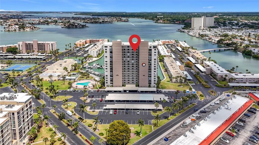 One or more photo(s) has been virtually staged. $10,000 PRICE REDUCTION - Don’t miss this unique opportunity! - Experience breathtaking water views from every angle in this stunning 14th-floor residence. Enjoy magnificent vistas from both the front and back of the unit, with both bedrooms offering serene water views—an exceptional and rare feature.  This spacious 2-bedroom, 2-bath condo offers over 1,300 sq. ft. of comfortable living space and is truly move-in ready. The kitchen features newer appliances.  The unithas just been recently painted. A brand-new washer and dryer have just been installed in the unit for added convenience. This unit comes with one covered carport. Located in a sought-after 55 plus gated community of Bay Island, residents enjoy resort-style amenities including six heated pools, tennis and pickleball courts, and a clubhouse with a beautifully appointed entertainment room, billiards room, workout room, and many other amenities. The building itself features a secure lobby and an inviting meeting/entertainment space.  The Bay Island community has a 1.5 mile walking path that goes around the entire community, great for short or long walks or fishing. This condo is located in the Admiral building which has passed its Milestone inspection in 2023. This building has a pool right next to the building for added entertainment. Enjoy serene waterfront living with a magnificent view, while being centrally located near the SunRunner bus line connecting the beaches to Downtown St. Petersburg. Just minutes to shopping, restaurants, and minutes to St. Pete Beach and the Gulf of Mexico. The beaches are just a short bike ride to the beach. You will want to enjoy all the shopping and restaurants on Corey Avenue and the Corey Avenue Sunday market on St. Pete beach which is just minutes away from this complex. This condo combines comfort, style, and an unbeatable location.A must-see opportunity to enjoy Florida waterfront living at its finest!