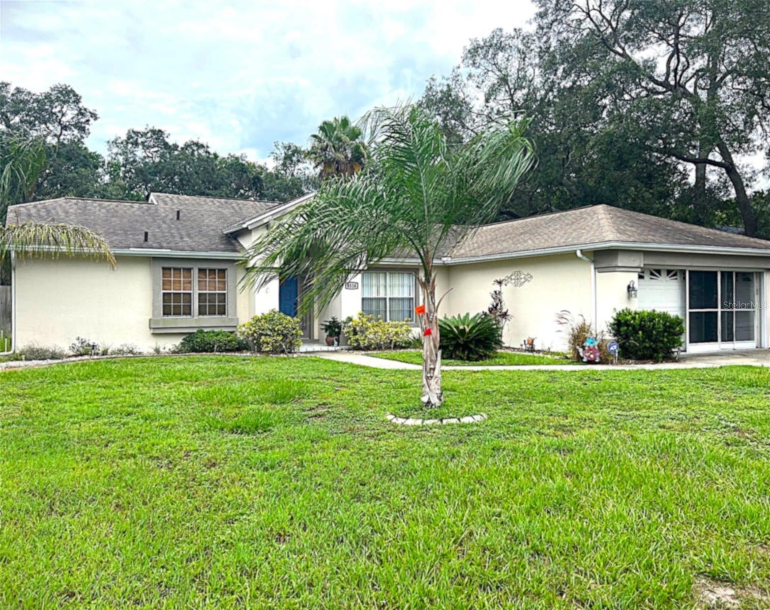 THIS BEAUTIFUL 3/2 single-family home located in the Berkeley Manor subdivision of Spring Hill, has all the charm, beauty and space that makes spending time at home a pleasure. Property features include high ceilings, a split floor plan with the primary suite on the left and two guest rooms on the right that share a full bathroom. The living/dining room combo is spacious with high ceilings, which adds elegance and a good-vibe-feel to the property. There is ample dining space for family and guests in the living/dining combo area, eat-in kitchen, and breakfast nook overlooking the kitchen that accommodates four bar stools. Step outside into the enclosed lanai overlooking a large, private fenced-in backyard (with storage shed), to enjoy your morning coffee, or spend quality time with family playing games, enjoying a family barbeque, or use it as the go to place where you can unwind and relax after a hard day’s work. The highlight of the property is the primary suite, which includes an ensuite bath with two separate vanities, ceiling fan, walk-in closet, and a cozy, large window seat. The guest bedrooms have big closets and ceiling fans. This property also features a laundry room with wash basin, laundry table, and shelving. The door in the laundry room leads to the spacious two-car garage that is well equipped with shelving to store tools and other household items. GREAT LOCATION! Situated in a quiet residential area, this home is conveniently located minutes away from shopping, beaches, dining, schools, banking, medical centers, hospital, and traveling is easy with highway US-19 and SR 589 close by. Tenant in place - lease ends August 31, 2025. All dimensions to be verified by tenant/tenant’s broker. Landlord is seeking tenants with a good income and credit score and a clear background check. You will love this home! Don’t wait - call today for a grand tour of the property.