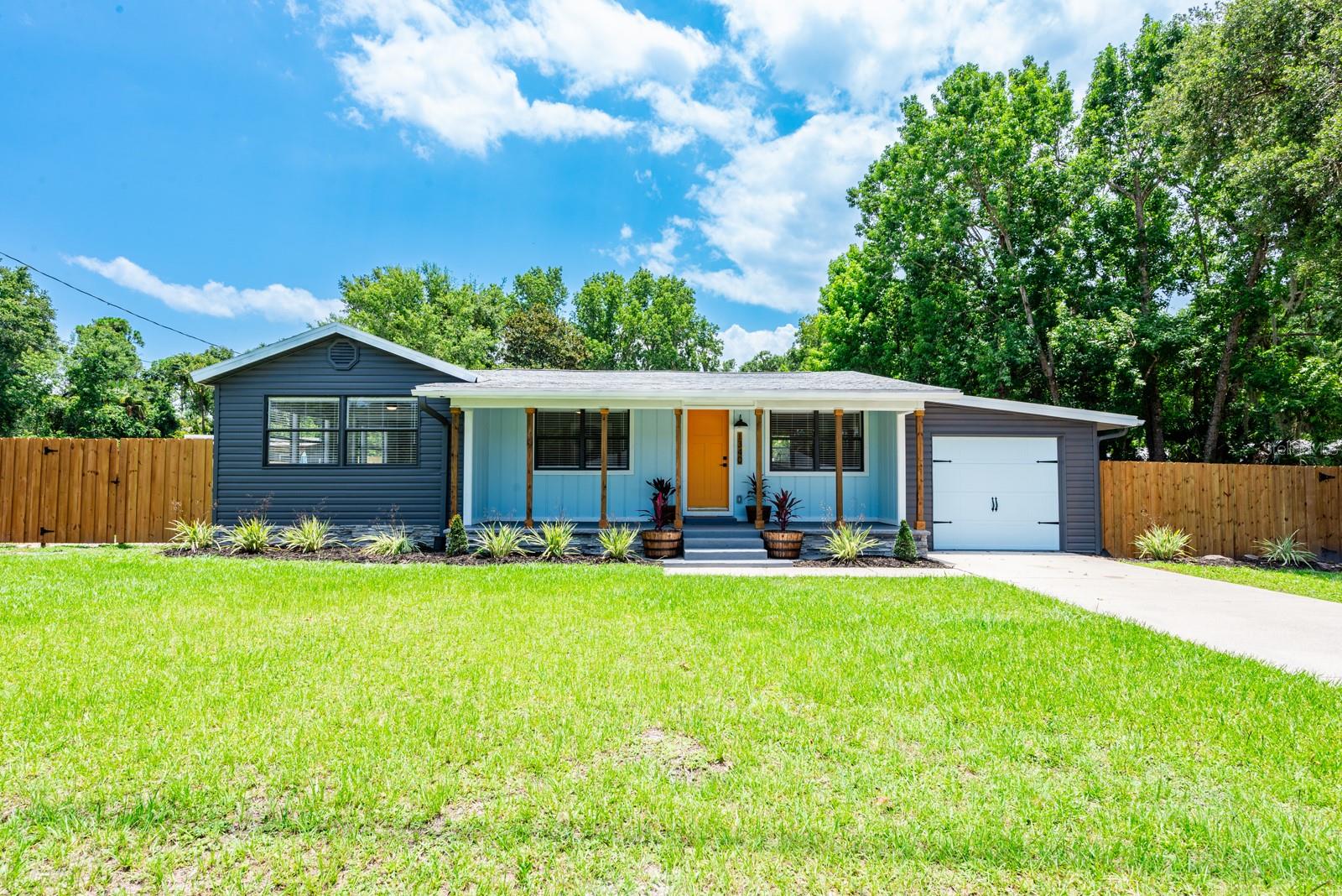 Step into your own slice of paradise in the heart of New Smyrna; located just 7 minutes from the beach! Welcome to this delightful home that exudes charm and offers a spacious open floor plan, featuring 3 bedrooms and 2 bathrooms, perfectly situated on a huge lot.
Upon entering the home, you'll be greeted by a warm and inviting living space filled with natural light. The seamless flow between the living room, dining area, and kitchen creates an ideal setting for both relaxation and entertaining.
The kitchen has shaker cabinets, along with giant breakfast bar with sparkling quartz counter tops and Samsung stainless steel appliances. There is luxury vinyl plank thru-out the house (no carpet). New paint & trim thru-out. Master has separate his/her mirrored closets with a large bathroom & there is also access to the rear patio.
The backyard is a secluded dream with a beautiful wood deck and privacy fence all the way around the perimeter. Enjoy the relaxing views of the adjacent pond and watch the turtles and fish swim by. There is a 12' wide RV gate and plenty of room for boats, toys, or a steel building. This home strikes the perfect balance between serenity and convenience. Embrace the laid-back coastal lifestyle while being just moments away from the pristine beaches, downtown, canal st. and an array of dining, shopping, and entertainment options. Plus, no HOA. This home has it all!