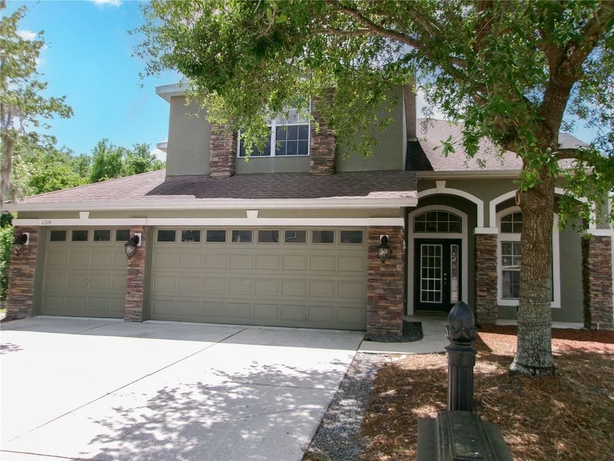 One or more photo(s) has been virtually staged. Welcome to this exceptional 5-bedroom, 3-bathroom home with a 3-car garage, located in the highly sought-after gated community of Waters Edge Two in New Port Richey. Perfectly positioned on a premium lot, this home offers serene privacy with a peaceful pond on one side and conservation views behind—creating a tranquil Florida retreat. Step inside to discover over 2,600 square feet of thoughtfully designed living space. The main level features a formal living and dining area, plus a spacious family room that seamlessly opens to the screened lanai and sparkling pool—ideal for indoor-outdoor living and entertaining. The beautiful kitchen is centrally located and well-appointed, while a downstairs bedroom and full bath provide flexibility for guests or a home office. Upstairs, the expansive primary suite offers two walk-in closets and a private bath, creating a true owner’s retreat. You’ll also find three additional bedrooms, a full bath, and a large bonus room—perfect for a media room, playroom, or additional living space.  Additional Highlights:  Zoned air conditioning system for efficiency and comfort ; Screened lanai with private pool ; 3-car garage with ample storage ; Well-maintained and move-in ready   Residents enjoy low HOA fees with access to outstanding community amenities, including a clubhouse, pool, fitness center, park, playground, boat ramp, and fishing access. This beautiful home offers the perfect blend of space, privacy, and lifestyle—ready to become your forever home in Florida.