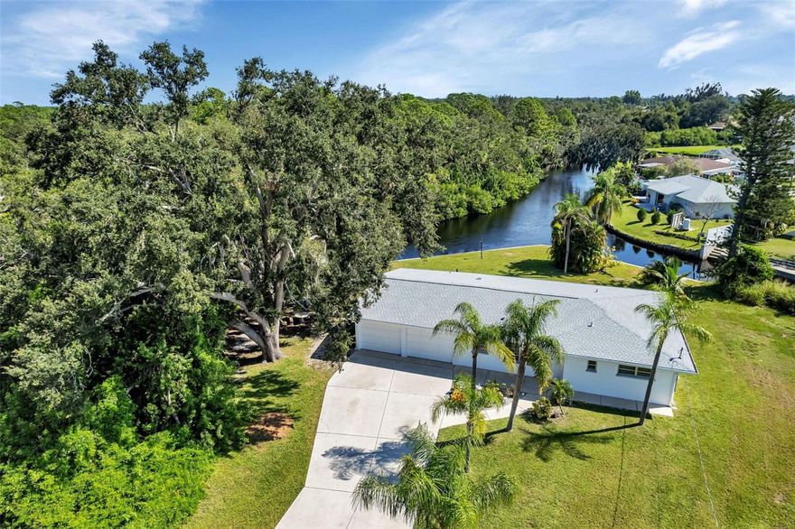 Welcome to your tranquil oasis! Nestled on a spacious .36-acre lot, this delightful property boasts 174 feet of picturesque creek and canal frontage. Located just 5 minutes away from the renowned Warm Mineral Springs, 20 minutes from the beautiful beaches, and a mere 10-minute drive to The Atlanta Braves ballpark for spring training, this home offers the perfect blend of relaxation and convenience. The home features 2 bedroom, 2 bath home with a 2 car garage and workshop area as well as a separate laundry/utility room. It comes furnished and has a brand new roof and soffits. Conveniently located between the Sarasota-Bradenton and the Punta Gorda airports.