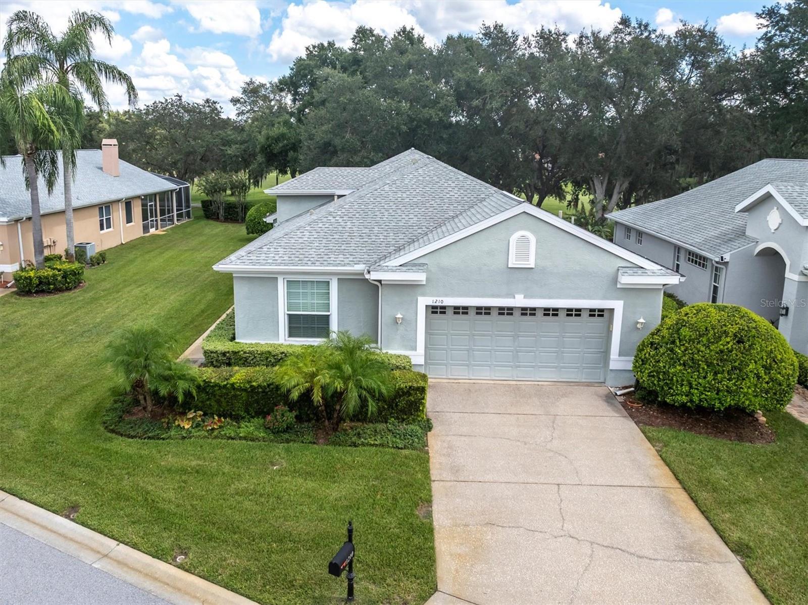 GOLF COURSE VIEWS - SPRAWLING ONE STORY - MAINTENANCE FREE - COMMUNITY POOL. Welcome to your dream home in the exclusive GATED COMMUNITY at Villages at Fox Hollow in the heart of Trinity. This beautifully designed and updated ONE STORY, 2 bedroom, 2 remodeled bathrooms, PLUS AN OFFICE, 2053 square foot home offers modern living and stunning golf course views. The open inviting split floor plan is perfect for entertaining family and friends or just relaxing. The spacious GREAT ROOM features soaring ceilings, crown molding, ceramic tile floors that run throughout most of the home, plantations shutters also throughout the home and french doors to the outdoor living space all flowing nicely into the chef inspired kitchen. The oversized kitchen is accentuated with quartz countertops, custom cabinets with pull out features to maximize storage space, tile backsplash, under the cabinet lighting, wine fridge, large closet pantry, a breakfast bar and separate kitchen nook for casual dining. The private primary suite is highlighted with rich hardwood floors, transom windows allowing for natural light to stream in, two walk-in closets, french doors to the outdoor screened in lanai and golf course views. The remodeled primary suite bath features a large walk-in shower, spacious vanity with double sinks, stone mica countertops that gives the countertops a shimmer and sparkle, a linen closet plus a private commode closet. The secondary bedroom is in the front of the home with easy access to the second remodeled bath including a tub & shower combination. This home also boasts a custom-designed dedicated office featuring built-in desks, cabinets, and drawers—perfect for productivity. The outdoor lanai has plenty of room for a dining, grilling and seating with beautiful tree lined views of the 6th fairway on the renowned, well groomed Fox Hollow Golf course, one of the last golf courses designed by legendary Robert Trent Jones Sr. Additional notable features of this home include an inside laundry room with utility closet, washer and dryer, impact windows (2009), HVAC (2016), roof (2013), water heater (2021), pre-plumbed for a water softener, in wall pest defense and a spacious 2 car garage with plenty of storage and built ins. Enjoy LOW HOA dues and MAINTENANCE FREE LIVING which includes cable TV, Internet, exterior and lawn maintenance, trash, a private community pool along with access to the Trinity Communities Park offering 4 pickle ball courts, 2 dogs parks, a playground and beautiful walking trail around a pond. This home is ideally located to shopping, restaurants, Suncoast & Pinellas trails, golf courses, beaches, cultural centers, Tampa and Clearwater/St. Pete International airports, beaches, top rated schools and more.
