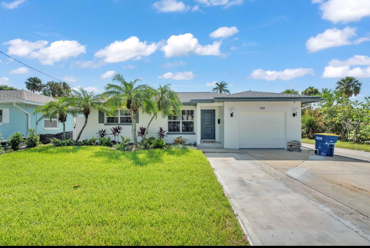 Discover your dream home in the exclusive Carlouel neighborhood! This fully renovated 3 Bed / 2 Bath block home sits on a serene street, boasting an open-concept design. The thoughtful split floorplan features a luxurious master suite with a custom tiled ensuite, flowing into a spacious family room and chef’s kitchen, complete with a massive eat-in island and premium GE Cafe appliances. Two additional bedrooms and a second custom tiled bath adjoin the bright living/dining area. Expansive sliding doors open to a retractable screened porch and tranquil backyard, perfect for a pool or spa. Enjoy modern conveniences like interior laundry, ample cabinetry, an epoxied one-car garage, and fresh landscaping.