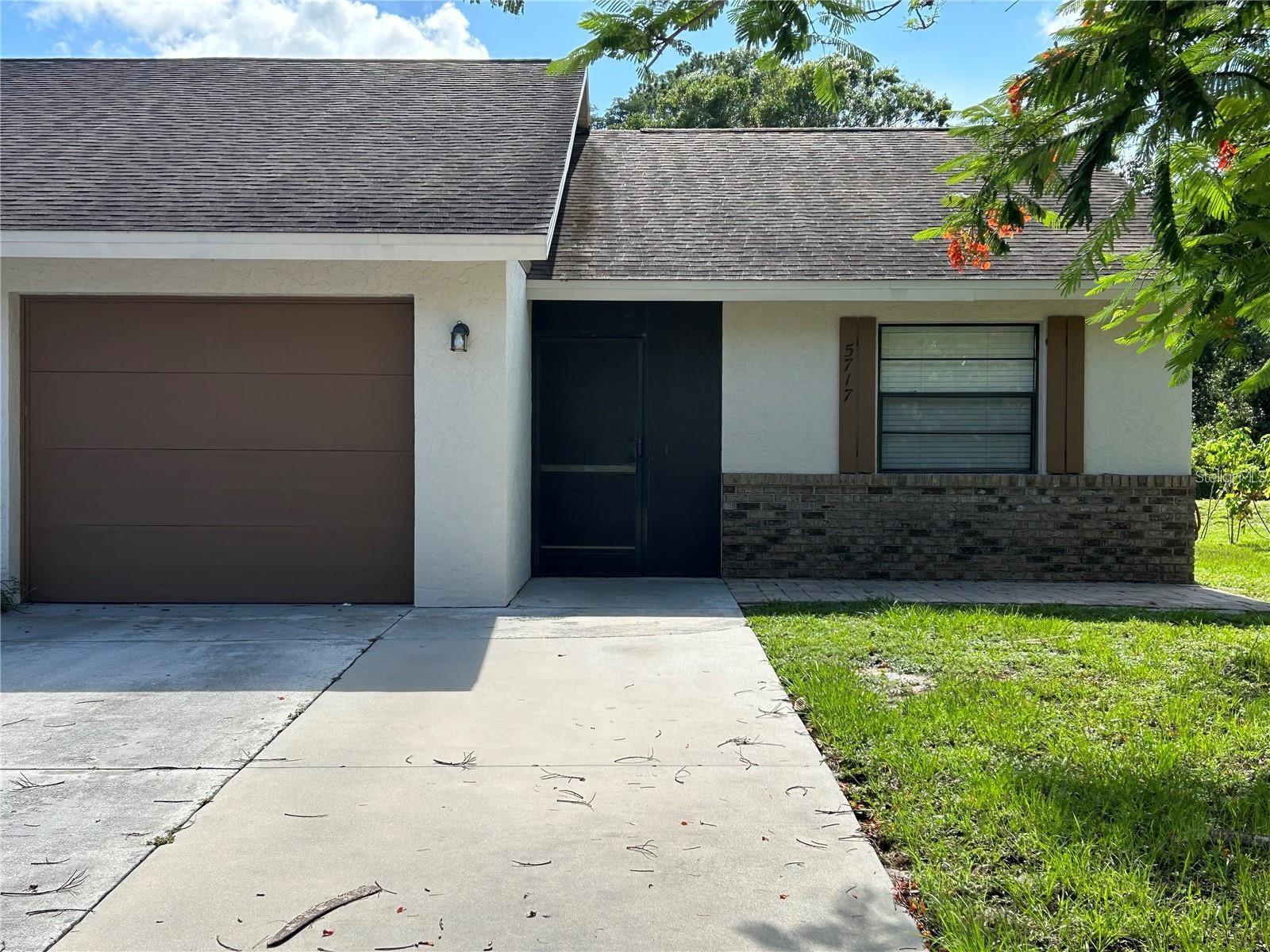 Welcome to this charming and beautifully maintained villa, offering the perfect blend of comfort, privacy, and style. This 2-bedroom, 2-bathroom home features fresh interior paint and a newer AC unit for year-round comfort. Step inside to a bright and open living area with tile flooring and an inviting layout that connects the kitchen, dining, and living spaces—ideal for relaxing evenings.
The kitchen is a standout with elegant granite countertops, white upper cabinets, and unique green base cabinets that add a touch of personality and warmth. Not to mention the gorgeous tile backsplash and charming open shelving. Both bedrooms have laminate wood floors, with the spacious primary suite boasting two closets and an en-suite bath. The split-bedroom floorplan ensures privacy for both residents and guests.
Enjoy Florida living with a screened front patio, a fully fenced backyard, and a large open patio that backs to a peaceful creek—an ideal spot for morning coffee or weekend gatherings. The garage and indoor laundry area are both climate-controlled for added convenience.
Located in a community with a fenced park, tot lot, playground, and sand volleyball court, this delightful villa truly has it all. Schedule your showing today and make this your next home!