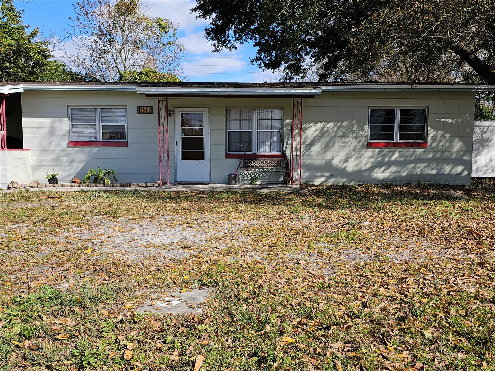 Quiet neighborhood with NO HOA. Wonderful opportunity with loads of potential. Spacious 3 Bedroom with 2 Full Baths. Block home with bonus room and enclosed rear patio with separate utility/laundry room. Very shady lot with mature fruit trees and fenced backyard. Interior features a Primary Bedroom with Private bathroom and two additional bedrooms that share a full bath. Livingroom/dining room with a spacious kitchen, access to a large rear covered and screened patio. New Roof installed 2024. Vinyl private fence. Community is conveniently located close to John Young and Osceola Pkwy.