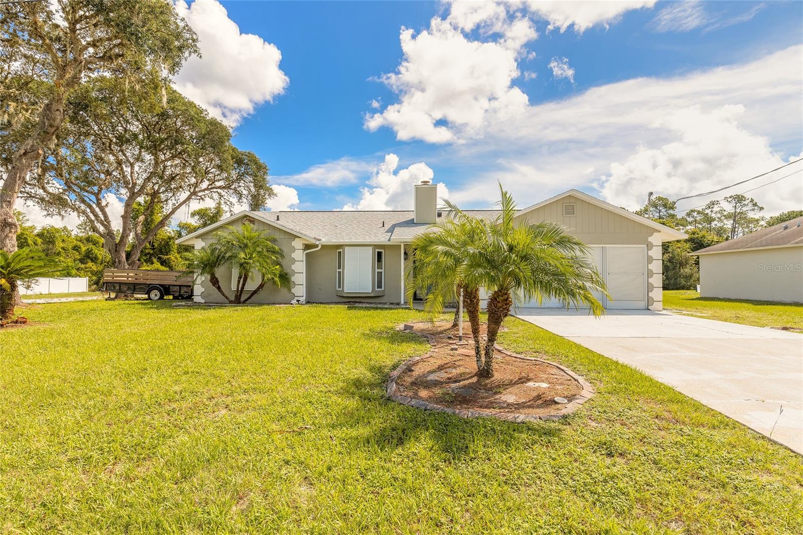 Welcome to your private oasis in the heart of Deltona! This beautifully maintained 4-bedroom, 2-bathroom home sits on a spacious corner lot and backs up to a serene wooded area —offering the peace and privacy you've been looking for. Step inside to discover a bright and open floor plan with ample living space, perfect for both relaxing and entertaining. The home features a spacious kitchen with plenty of cabinet storage and counter space, flowing seamlessly into the dining and living areas.The split-bedroom layout offers a private master suite complete with a full en-suite bathroom, while three additional bedrooms provide plenty of space for family, guests, or a home office. Step outside to your very own backyard retreat, featuring a screened-in inground pool surrounded by mature trees and nature—no rear neighbors in sight! Whether you're enjoying a quiet morning coffee or hosting weekend gatherings, this outdoor space is perfect for Florida living.Located in a quiet, well-established neighborhood, this home offers the best of both worlds—peaceful, natural surroundings with convenient access to shopping, schools, and major roadways.Don’t miss your chance to own this unique property that combines privacy, location, and comfort. NEWER A/C, Fence, Washer/Dryer - 3 years. NEWER Roof, Appliances - 4 years. Pool system is 2 years old and NEW paint, carpet. NO HOA - Schedule your showing today!