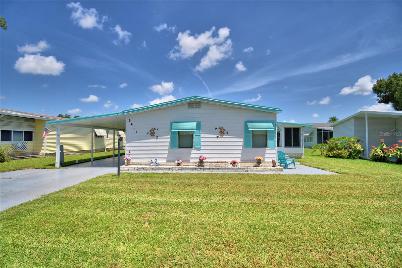 Furnished 3-bedroom 2 bath mobile home in the great little community of Garden Grove Oaks. Shopping is nearby and the homes are well kept. The clubhouse is within proximity, just a short walk from the home. Enjoy the community clubhouse and pool, and many shuffleboard courts, all included in the small monthly HOA fee. There is fenced storage available for RV's and boats for a fee. Enjoy lots of living space, including a relaxing jet tub in the primary bath for serenity after a long day. Hobbyists will love the large workshop. The spacious Florida Room is perfect for entertaining. This is the place for relishing our mostly temperate, comfortable winter and evening weather, either on the patio, Florida Room, or taking advantage of the clubhouse and other amenities.
