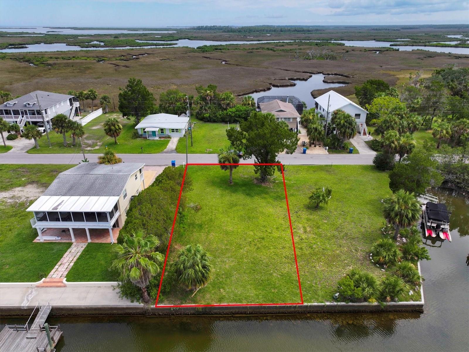 Build Your Gulf Coast Fishing Retreat – 60 FT of Direct Gulf Access Canal Frontage with Stunning Marsh Views!
Welcome to Hernando Beach, where your dream of coastal living meets the ultimate boater’s paradise. This exceptional direct Gulf access building lot offers 60 feet on a saltwater canal with no fixed bridges standing between you and open water—ideal for serious anglers and boating enthusiasts alike. Imagine catching redfish, snook, and snapper right from your backyard while dolphins and manatees cruise by in the tide.
Located in the most desirable section of Hernando Beach, this rare property offers unrestricted boating access, gorgeous unobstructed marsh views, and no HOA or deed restrictions. That means short-term rentals are allowed, trailers and commercial vehicles are permitted, and privacy fencing up to 8 feet high is welcome.
This is the section of Hernando Beach that boaters covet most—where the saltwater canals rise and fall with the tides and lead straight to the Gulf of Mexico. Hernando Beach is a secluded coastal hamlet tucked away along Florida’s Nature Coast—quiet and private, yet only minutes to US-19 for shopping, dining, hospitals, and big-box conveniences. Tampa International Airport is just an hour away, and the magic of Orlando is only a 90-minute drive.
Explore world-class inshore and offshore fishing, indulge in fresh seafood from local markets, or enjoy a laid-back waterfront vibe with tiki bars and marinas just around the corner. Plus, you're only 5 minutes from the crystal-clear waters of Weeki Wachee Springs, perfect for kayaking, paddleboarding, and swimming year-round.
Whether you're looking to build your forever home, a weekend getaway, or a lucrative short-term rental, this lot offers endless possibilities. Come live the Gulf Coast fishing lifestyle where every tide brings new adventure.