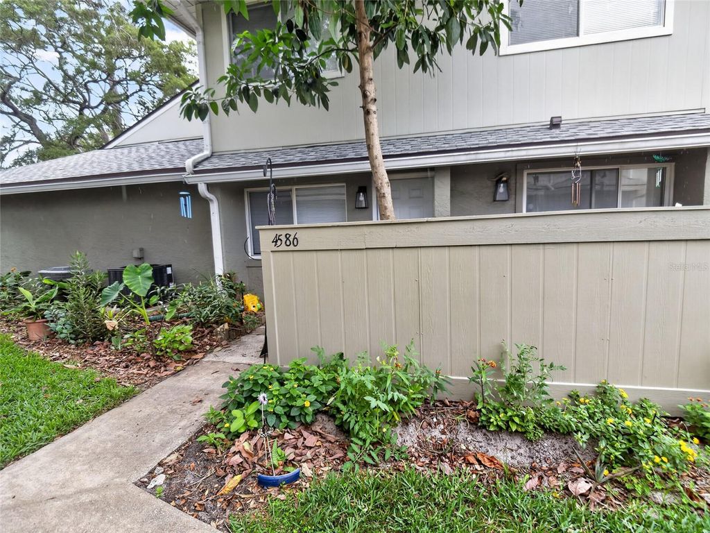 Photo of 4586 Pheasant Run Drive #B, Orlando, FL 32808 (MLS # O6409869)