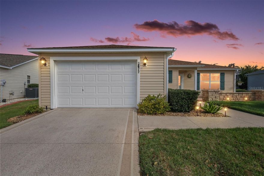 GORGEOUS, METICULOUSLY-MAINTAINED, TURNKEY 3/2 Corpus Christi (Amarillo) featuring a WONDERFUL FRONT PAVER PATIO with seating wall, ENCLOSED LANAI, and REAR PAVER PATIO with PRIVACY LANDSCAPING! IDEALLY LOCATED in the Village of Duval—between County Roads 466 and 466A and JUST MINUTES from BOTH Lake Sumter Landing and Brownwood Paddock Squares with shopping, dining, and nightly live entertainment! ROOF 2020, HVAC 2019, HWH 2024. This AMAZING home is MOVE-IN READY! Just bring your toothbrush! The lovely exterior features a DECORATIVELY PAINTED walk and driveway, LOW-MAINTENANCE STONED planting beds, and a QUAINT PAVER FRONT PATIO with SEATING WALL - ideal for RELAXING in the Florida sunshine or ENJOYING fun-filled OUTDOOR ENTERTAINING with friends! A LEADED GLASS entry with storm door welcomes you in to the GENEROUS foyer. HIGH VAULTED ceilings and an OPEN-CONCEPT floor plan seamlessly connect the living, dining, and kitchen areas creating a BRIGHT, EXPANSIVE main living space. THREE strategically placed SOLAR TUBES fill the home with ABUNDANT NATURAL LIGHT while DIAGONAL TILE flooring in the main areas offers a sleek, MODERN look with easy maintenance. The STUNNING kitchen boasts WHITE and GRAY SHAKER cabinetry with PULL-OUTS, QUARTZ countertops, STAINLESS appliances, hallway PANTRY, and an EAT-IN breakfast bar for casual dining. From the living room, step through sliding glass doors into the inviting ENCLOSED lanai featuring a ceiling fan, solar shades, EPOXY PEBBLE flooring, and lush mature PRIVACY landscaping. This peaceful OUTDOOR RETREAT is perfect for enjoying your morning coffee or unwinding in comfort. Just outside, an ADJACENT PATIO offers a great space for grilling and entertaining guests! Back indoors, the primary bedroom features LAMINATE flooring, DOUBLE windows, and a GENEROUS WALK-IN closet. Its en-suite bathroom boasts WOOD cabinetry with NEUTRAL countertops, a WALK-IN shower, and a LINEN closet. A SPLIT FLOOR PLAN places two additional bedrooms and a second bathroom across the home behind a POCKET DOOR creating a PRIVATE guest wing and/or a QUIET home office. Bedroom two offers DOUBLE windows and a built-in closet. The second bathroom features a WOOD vanity with NEUTRAL countertop, tub and shower combination, and a LINEN closet. Bedroom three (no closet) offers DOUBLE windows. This additional room can function as either a home office, den, or an additional sleeping area. Completing the package is a 18’x26’ garage boasting a GENEROUS laundry area with shelving, UTILITY SINK with additional corner shelving, INSULATED garage door, and PLENTY of space for a car and a golf cart! DON’T MISS YOUR OPPORTUNITY TO OWN THIS FABULOUS HOME! The Village of Duval is IDEALLY LOCATED by BOTH Lake Sumter Landing and Brownwood Paddock Squares; Surrounded by popular recreation centers, including SeaBreeze Regional Recreation Center; Duval, Truman, Sterling Heights, and Colony Cottage Recreation Centers; A short golf cart ride to DOZENS of Executive Golf Courses as well as Havana, Cane Garden, Evans Prairie, Mallory Hill, and Bonifay Country Clubs and Championship Golf Courses; JUST MINUTES to either 466 or 466A with abundant shopping, dining, banking, medical, and more! PLEASE WATCH OUR WALKTHROUGH VIDEO of this INCREDIBLE TURNKEY HOME and call today to schedule your Private Showing or Virtual Tour!