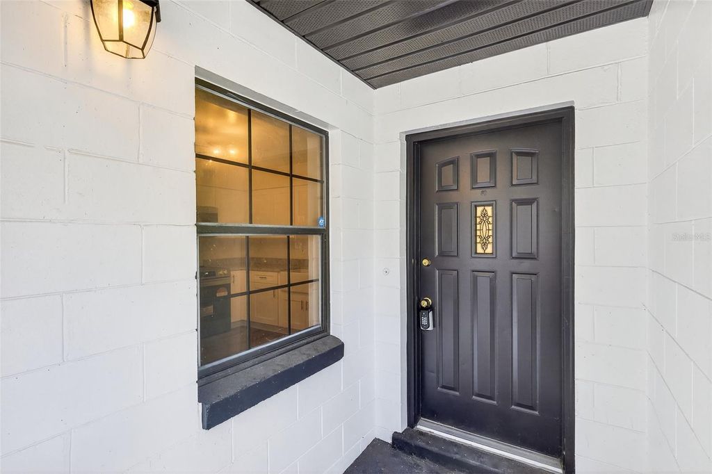 Photo of 303 E Fountain Street, Fruitland Park, FL 34731 (MLS # O6372036)