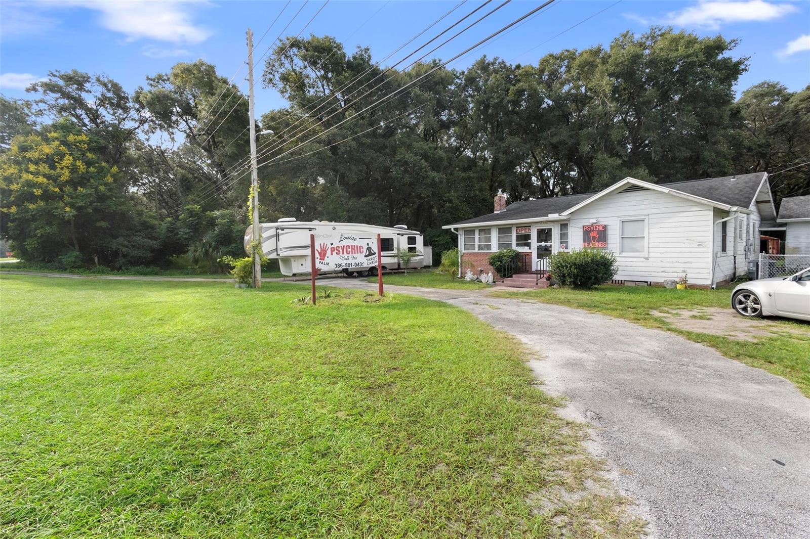 Exceptional Opportunity: Three Parcels with 3 structures on Woodland Boulevard. We are pleased to present a prime opportunity to acquire three parcels located along Woodland Boulevard. The property is zoned for mixed use, providing investors with the potential to develop these sites into profitable ventures. The properties: 2480, 2490 and 2498—are being offered in "as-is" condition, and the seller is open to including all existing assets on the property, including the current business. All three parcels for sale totaling 2.03 acres at 2480, 2490, and 2498 Woodland Blvd. 2480 Woodland Blvd: 0.83-acre mixed-use property with 1,401 sq. ft. structure, built in 1946. Currently being used as a psychic reading business includes a pool added in 1992 and separate garage (208 sq. ft.).
2490 Woodland Blvd: 0.67-acre mixed-use property featuring a 1,549 sq. ft. structure, built in 1950, currently used as a car lot.Situated near international speedway blvd and outside historic Downtown DeLand, this location offers endless possibilities for development or renovation. Don’t miss out on this unique investment opportunity.