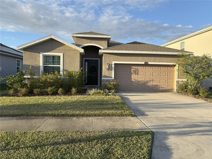Located in the picturesque community of Mirada just north of Tampa, this stunning one-story, four-bedroom, two and a half bath residence offers a blend of comfort and modern appeal. The open concept and split bedroom layout ensure privacy and versatility, with the exquisite primary suite thoughtfully positioned at the rear of the home, while three additional bedrooms are conveniently located toward the front. Enjoy culinary excellence in the modern, updated kitchen featuring a spacious island illuminated by three elegant pendant lights, exceptional granite countertops, 42-inch wood cabinets, and upgraded stainless steel appliances. This inviting home provides a peaceful retreat after a long day's work, set within a vibrant, active neighborhood. Mirada’s crowning jewel is its spectacular lagoon—a unique, resort-style amenity boasting crystal-clear waters ideal for swimming, kayaking, paddleboarding, and relaxing along picturesque sandy beaches. Residents enjoy exclusive access to upscale cabanas, beach volleyball courts, and a variety of water sports, creating a vacation atmosphere every day. With scenic walking trails, lush parks, and convenient proximity to shopping, dining, and top-rated schools, Mirada offers an unparalleled community lifestyle where every day feels like a getaway.