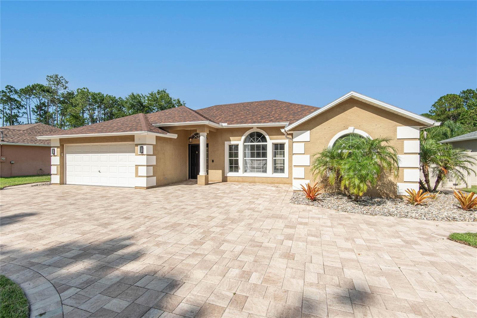 POOL HOME IN THE INDIAN TRAILS NEIGHBORHOOD! Looking for a place to live out the Florida lifestyle? You've found it! Enjoy relaxing days by your heated spa/saltwater pool and a 20 minute drive to Flagler Beach! The luxury kitchen features stone countertops, center island, stainless steel appliances, wine fridge, and an abundance of cabinet space! Secondary bathroom has been beautifully updated and boasts a walk in shower, rain shower head, stone countertop, and smart mirror. Property is located close to the heart of Palm Coast where you will find restaurants, entertainment, shopping, nature parks, community center, hospitals, and more! Come see your dream home!