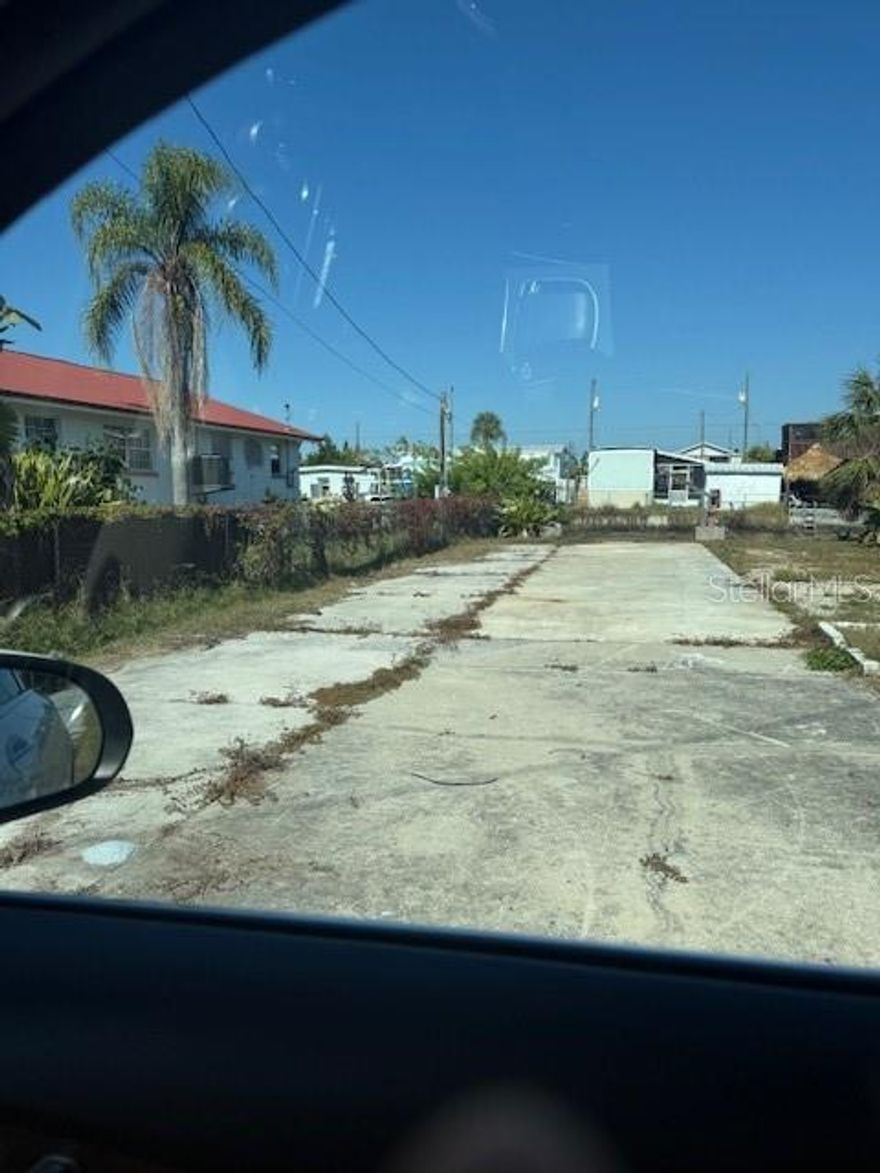 Ready-to-build lot waiting for you. THIS WATERFRONT COMMUNITY LOT IN VISTA DEL MAR has 1752 square feet of poured concrete with underground utilities to build your dream home or investment property.  Utilities ready to go.  NO HOA.  Chain link fence with 3 gates in front. WATERFRONT seawall and boat davits included. Direct access to the Gulf.  Nice big lot to build.  Mobile Homes allowed.  Located near beach, local eateries, and major thoroughfares. KEY FEATURES LOT SIZE --3200 sq ft. UTILITIES --READY TO GO LOCATION--CONVENIENT WATERFRONT