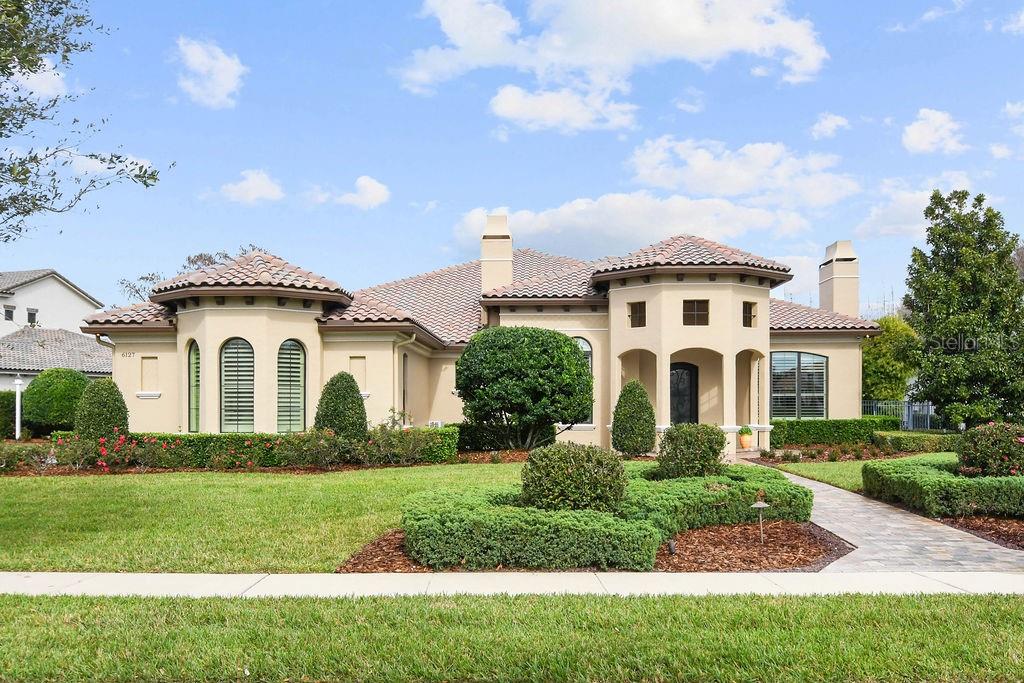 Charming Single-Story Home in Sought After Waterstone Community
Welcome to this exquisite residence just under 5000 sq ft, nestled in the serene guard-gated community of Waterstone, boasting a breathtaking conservation area view. This one-story gem, situated on an oversized lot, offers an unparalleled living experience with private access to the esteemed Windermere Preparatory School.
Key Features:
Stunning Views and Location: Enjoy the tranquility of a conservation area right from your backyard, offering a peaceful retreat from the bustling city life.
Spacious and Elegant Design: This home featuring 4 fireplaces, has a thoughtful layout with spacious rooms, designed for comfort and luxury. The single-story design ensures easy accessibility and a seamless flow throughout the home.
Entertainer's Dream: The heart of this home is the open-plan living, dining, and kitchen area. It's a perfect space for hosting gatherings, with ample room for guests to mingle comfortably.
Gourmet Kitchen: A chef's delight, the kitchen is equipped with high-end appliances, beautiful countertops, and a large island. The hidden walk-in pantry provides abundant storage while keeping your kitchen clutter-free.
Luxurious Master Suite: The master bedroom is a private sanctuary with a separate sitting area, ideal for relaxation. It's a perfect space to unwind after a long day.
Enclosed Lanai: The air-conditioned lanai offers additional living space, perfect for enjoying the Florida weather year-round without the discomfort of extreme temperatures.
Saltwater Pool: Dive into your own private saltwater pool, a centerpiece for outdoor entertainment and relaxation.
Exclusive Community Amenities: Living in Waterstone means access to top-tier amenities, including 24-hour security, beautifully maintained grounds, and private pathways to Windermere Prep.
This home is more than just a residence; it's a lifestyle choice for those seeking luxury, privacy, and convenience in one of the most sought-after communities in the area. Don't miss the opportunity to own this magnificent home in Waterstone.