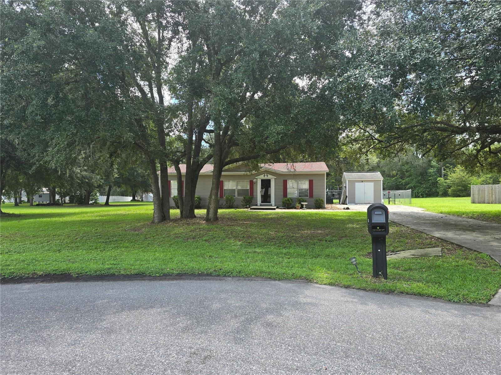 3 Bed, 2 Bath Home on .55 Acre Cul-de-Sac Lot – Lexington Estates
Welcome to this beauty, Built IN 2007, 3-bedroom, 2-bathroom mobile home nestled in the desirable Lexington Estates community! Sitting on over half an acre in a peaceful cul-de-sac, this home offers both space and privacy , roof has been replaced— with a beautifully manicured lawn and mature shade trees that enhance the home's curb appeal.
Step inside to a bright, open floor plan featuring a spacious living room with a cozy fireplace, ideal for relaxing or entertaining. The gorgeous kitchen is a cook’s dream, offering ample cabinet and counter space for all your culinary needs.
Enjoy the split floor plan for added privacy, with a luxurious master suite that includes a jacuzzi tub, walk-in shower, and generous closet space. Two additional bedrooms are well-sized, and one features carpet (in need of replacement) — while vinyl flooring flows throughout the rest of the home. There's also a dedicated indoor laundry room for your convenience.
Outside, you’ll love the spacious front yard, fenced backyard, and included shed with tools and lawn mower (available for negotiation). Shopping, dining, and nature trails are just minutes away, offering the perfect balance of convenience and tranquility.