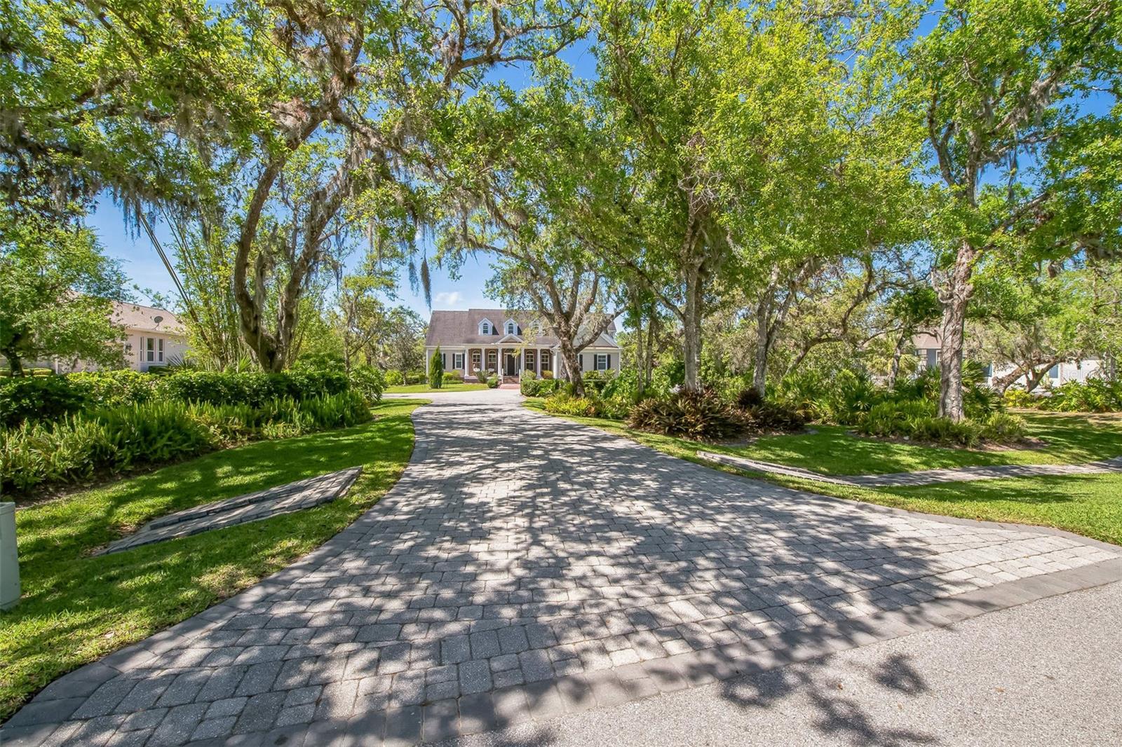 Welcome to 1570 Oakford Rd, a breathtaking 4-bedroom, 2 full-bath, 2 half-bath estate with 4,300 sq. ft. of living space, nestled on just under an acre of lush, private land. Surrounded by mature trees—including magnolias, oaks, cedars, and bamboo—this home offers unparalleled privacy and serenity, where you can often spot deer grazing in the backyard. Thoughtfully positioned on the lot, this home provides ample space in both the front and backyards, ensuring plenty of privacy.
As you approach, a spacious front porch welcomes you, set back from the road and framed by gorgeous landscaping. Step inside, and you’ll be captivated by the exceptional craftsmanship and attention to detail, from intricate woodwork to plantation shutters throughout the home. The high ceilings on both floors create an airy, elegant atmosphere, with coffered ceilings on the first floor adding a touch of grandeur. Custom lighting features and built-ins throughout the home, paired with dimmers in key areas, allow you to create a warm and inviting ambiance at any time of day.
The gourmet kitchen is a chef’s dream, featuring a gas stove, premium upgraded appliances, and an open layout perfect for entertaining. Just off the kitchen, a cozy breakfast nook offers the perfect spot to enjoy morning coffee, while a separate formal dining room provides an elegant space for hosting dinner parties.
The luxurious master suite, located on the ground floor, is a true retreat. It features tray ceilings with a custom finish, a grand double-door entry, and direct access to the pool area. The spa-like ensuite includes an oversized shower, travertine tile flooring and shower, his-and-hers sinks, and a private water closet. His-and-hers walk-in closets provide ample storage, completing this exquisite primary suite.
The remaining three oversized bedrooms are located on the second floor, each easily accommodating a king-size bed.
Throughout the home, French doors open onto the pool area, allowing for wonderful natural light and airflow. The back patio and pool area are elevated, offering a great view of the property and enhancing the home’s connection to its serene surroundings. Step outside to your caged pool and hot tub, an outdoor kitchen, and a fully fenced yard—perfect for gatherings or quiet evenings under the stars.
For added convenience, the home features two attached garages, offering ample space for parking or storage. The double garage is equipped with a Tesla EV charger, making it ideal for electric vehicle owners.
This home is a rare find, blending character, quality craftsmanship, and modern upgrades in a stunning natural setting. Don’t miss your chance to own this exceptional property—schedule your private tour today!