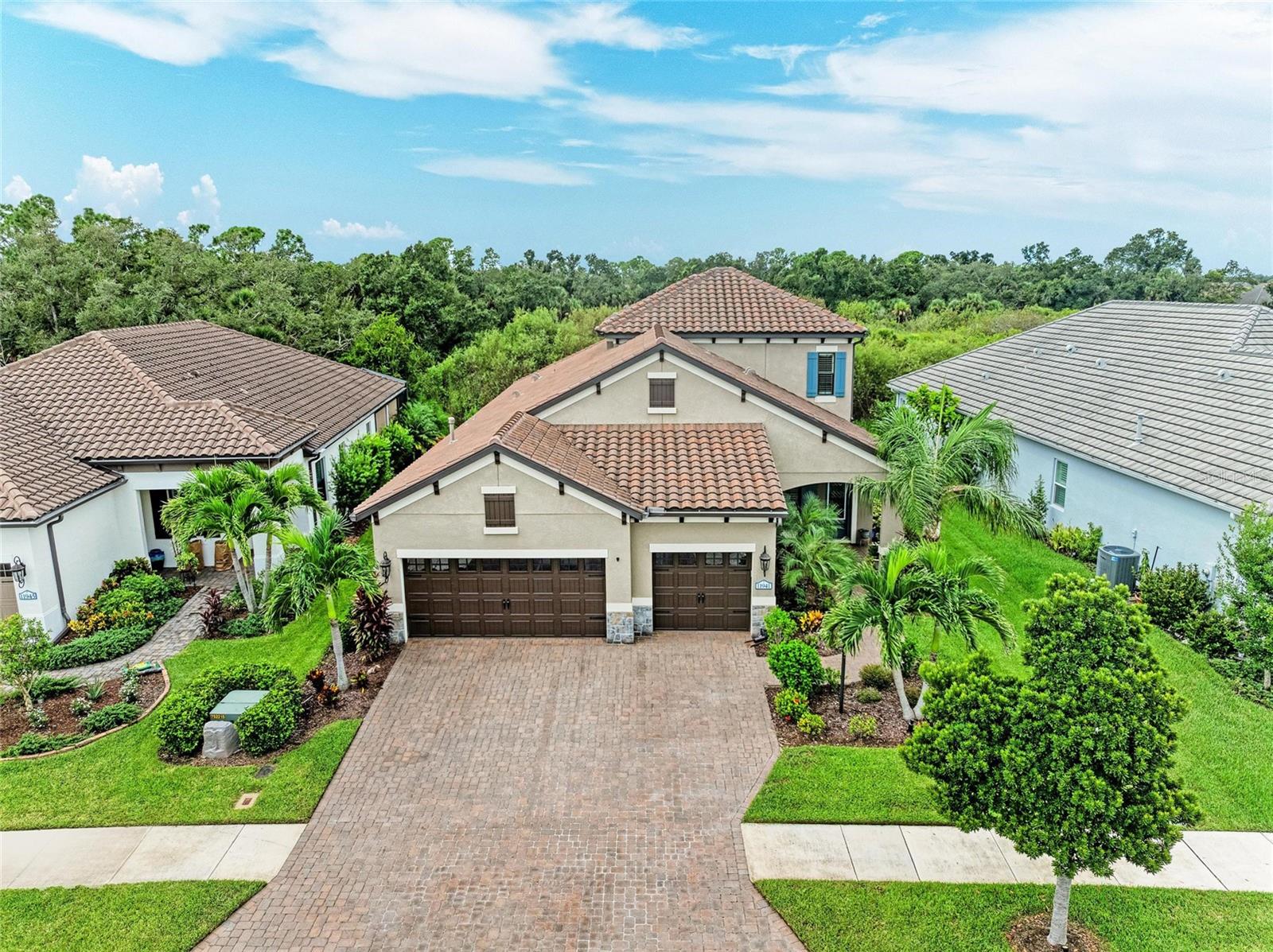 Experience Florida living at its finest in this stunning preserve view pool home located within the coveted community of Grand Palm in Wellen Park! Designed for both relaxation and entertaining, this 4 bedroom plus den, 3.5 bath, 3 car garage home offers the perfect blend of indoor comfort and outdoor Florida living. Step outside to your private oasis featuring a secluded view, an oversized heated saltwater pool and spa and a stunning outdoor kitchen with bar seating, a prep sink, propane grill, and mini fridge. Protect your lanai with ease with the Smart motorized hurricane shutters, offering peace of mind all year round. The pool itself features a sun shelf, fountains, and remote controlled color changing lights, making entertaining effortless. Inside, you’ll find a gourmet kitchen with premium finishes, including a range hood, cooktop, and built-in wall oven. Pocket sliders in the dining area seamlessly connect indoor and outdoor living, while the den in the front of the home offers custom built-ins for crafting or office needs. The large master is secluded near the pool area and offers walk-in closets and an expansive Roman shower The two downstairs bedrooms feature adorable striped walls and a Jack-and-Jill bathroom with dual vanities. Upstairs, the bonus room offers endless possibilities from a movie room, game room, additional office, or space for guests. The large upstairs bedroom is truly a second master with a walk-in closet and large private bath. Additional highlights of the home include impact glass on the second story, a whole-house water softener, plantation shutters throughout, decorative casings by the living room sliders, and crown molding throughout. This home is NOT in a flood zone- meaning no flood insurance is required. Enjoy resort-style living with access to Grand Palm’s countless amenities, including 3 different pools, a fitness center, 8 pickleball courts, tennis courts, dog park, miles of walking and biking trails, and more—all just minutes from Venice’s Gulf beaches, dining, shopping, the brand new downtown Wellen Park, and A rated Sarasota County Schools. This home truly has it all—schedule your private showing today!