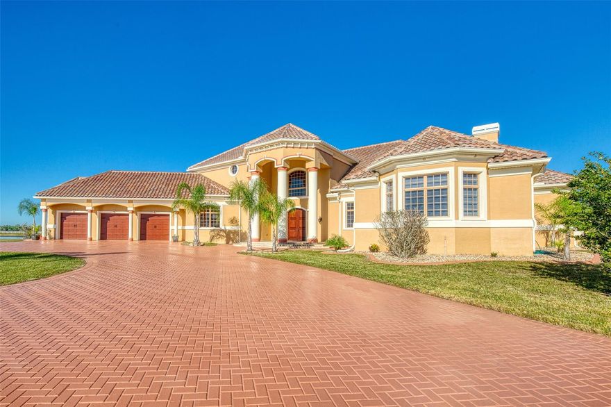 GATED PRIVATE LAKEFRONT ESTATE LIKE NO OTHER IN THE AREA. THIS LUXURIOUS COUNTRY ESTATE STRETCHES OVER 30 ACRES AND OFFERS A 12 ACRE PRIVATE MAN MADE LAKE THAT MEASURES 1800 FT LONG BY 185 FT WIDE WHERE YOU CAN LAND SEAPLANES OR USE POWERBOATS. THE PROPERTY ALSO OFFERS A 12 STALL HORSE BARN, VOLLEYBALL COURT, 2.5 MILES OF VINYL FENCING AND EVEN A ZIPLINE FROM THE PROPERTY TO ONE OF THE 2 PRIVATE ISLANDS IN THE LAKE. ULTIMATE LUXURY IS DISPLAYED IN THIS 6 BEDROOMS, 8 BATH PLUS 2 HALF BATH ESTATE, WITH ALMOST 10,000 SQ FT OF GORGEOUS LIVING SPACE. A RELAXING AND SOPHISTICATED ATMOSPHERE WELCOMES YOU IN, WITH SOARING HIGH CEILINGS, TRAVERTINE FLOORS THROUGHOUT, CROWN MOLDING, TRAY CEILINGS, SURROUND SOUND, SMART HOME SECURITY SYSTEM WITH CAMERAS, CENTRAL VAC, JUST TO NAME A FEW. THIS ESTATE PERFECTLY BLENDS MODERN DESIGN WITH LEISURE ORIENTED AMBIANCE AND, CUSTOM QUALITY CRAFTSMANSHIP CAN BE SEEN AT EVERY CORNER. TREMENDOUS CHEF'S GOURMET STYLE KITCHEN WITH GRANITE COUNTERTOPS, WOOD CABINETS, DOUBLE OVEN, CENTER ISLAND WITH WARMING DRAWER, AND LARGE BREAKFAST BAR. THE AMPLE DINING ROOM BOASTS INTRICATE TRAY CEILING AND BEAUTIFUL VIEWS OF THE GROUNDS. MASTER RETREAT FEATURES DOUBLE SIDED FIREPLACE, DOUBLE VANITY SINKS, CENTER TUB WITH HUGE DOUBLE WALK IN SHOWER, LARGE HIS /HERS CLOSET WITH CUSTOM CABINETS AND EVEN A PRIVATE OFFICE /SITTING ROOM OFF OF MASTER WITH ITS OWN BATHROOM. THE GATHERING ROOM WAS DESIGN WITH ENTERTAINING IN MIND, OFFERING A WET BAR, GORGEOUS FIREPLACE AND A NICE OPEN FEEL WITH MANY ARCHITECTURAL DETAILS. FRENCH DOORS LEAD YOU TO THE OUTDOOR LIVING SPACE THAT IS AS IMPRESSIVE AS THE INSIDE. SWIMMING POOL WITH JACUZZI, SUMMER KITCHEN, HUGE COVERED LANAI AREA AND ENDLESS POSSIBILITIES FOR ENTERTAINING OR TO SPEND QUIET NIGHTS IN OVERLOOKING THE SUNSET.