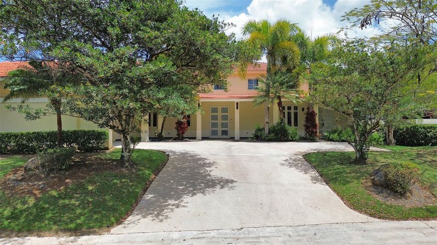Step into refined tropical living with this exceptional residence located in one of Dorado’s most acclaimed communities, Sabanera Dorado. Set on a desirable corner lot spanning 1,165 square meters, this impressive home offers a total of 5,450 square feet, with 3,600 square feet of interior space.

Boasting 6 bedrooms, 5 full bathrooms, and a dedicated office space, the home is thoughtfully laid out to provide both comfort and functionality for family living, remote work, and entertaining. Upon entering, you are welcomed by an open-concept living area featuring soaring double-height ceilings, abundant natural light, and renovated flooring. The seamless flow between living, dining, and outdoor spaces creates an inviting and airy atmosphere throughout.

The outdoor area is truly a private oasis. Surrounded by lush tropical landscaping and mature palm trees, the backyard showcases a resort-style pool with an integrated spa, perfect for relaxing or entertaining. A covered terrace offers an ideal setting for al fresco dining, complete with ample space for gatherings while enjoying the serene surroundings.

Designed for both relaxation and lifestyle, this home is located within an exclusive gated community known for its privacy, security, and exceptional amenities. Residents enjoy access to recreational facilities and are conveniently located near a highly regarded and distinguished school, Tasis, making it an ideal choice for families.