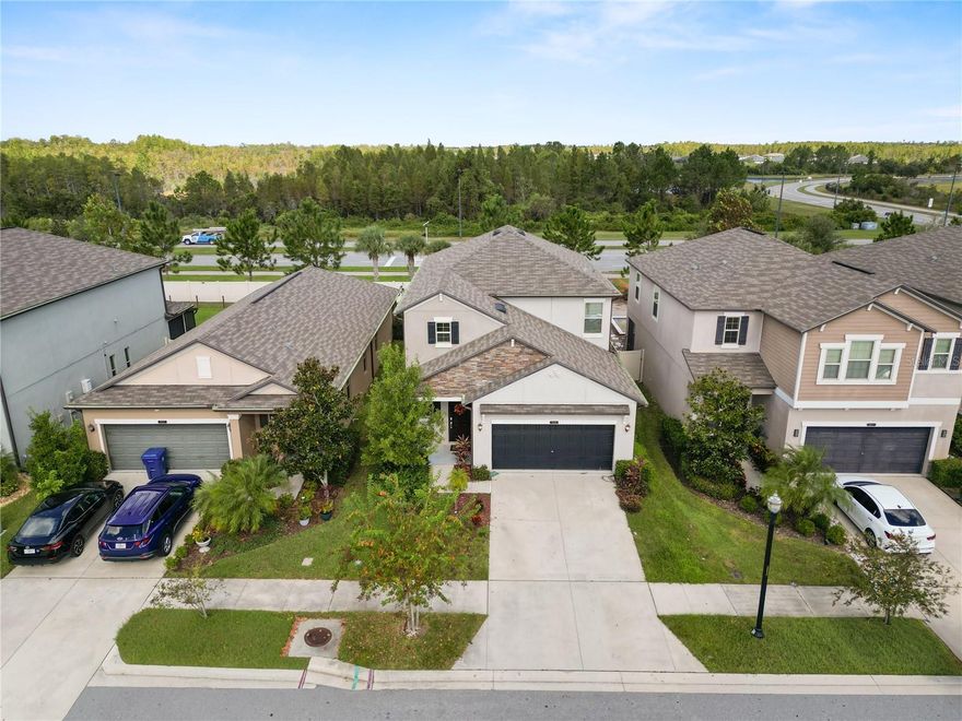 Welcome home, nestled in the highly sought-after Connerton community of Land O’ Lakes! Built in 2020, this beautifully 5-bedroom, 3-bath home offers over 2,400 sq ft of spacious, modern living with an open-concept design perfect for entertaining and everyday comfort. Offering new interior paint throughout. Step inside to find a bright foyer leading into the expansive great room, featuring high ceilings, neutral tones, and tile flooring throughout the main living areas. The chef’s kitchen is the centerpiece of the home, showcasing granite countertops, stainless steel appliances, a large island with seating, and a walk-in pantry. The dining area overlooks the screened lanai — perfect for relaxing Florida evenings. The primary suite offers a private retreat with a spa-like ensuite bathroom complete with dual vanities, and a spacious walk-in closet. Enjoy the Florida lifestyle with your covered lanai and peaceful backyard — ready for outdoor gatherings or playtime with pets. Located within the master-planned Connerton community, residents enjoy resort-style amenities including a resort-style pool and splash park, fitness center, clubhouse, playgrounds, basketball, tennis, and volleyball courts, as well as scenic nature trails, bike paths, and parks surrounded by preserved wetlands. Golf-cart friendly and community-oriented, Connerton offers a vibrant lifestyle with regular neighborhood events and easy access to top-rated Connerton Elementary, shopping, and major highways.