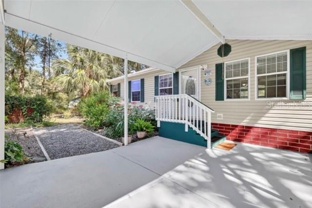 Photo of 5841 SE 164th Avenue, Ocklawaha, FL 32179 (MLS # TB8456265)